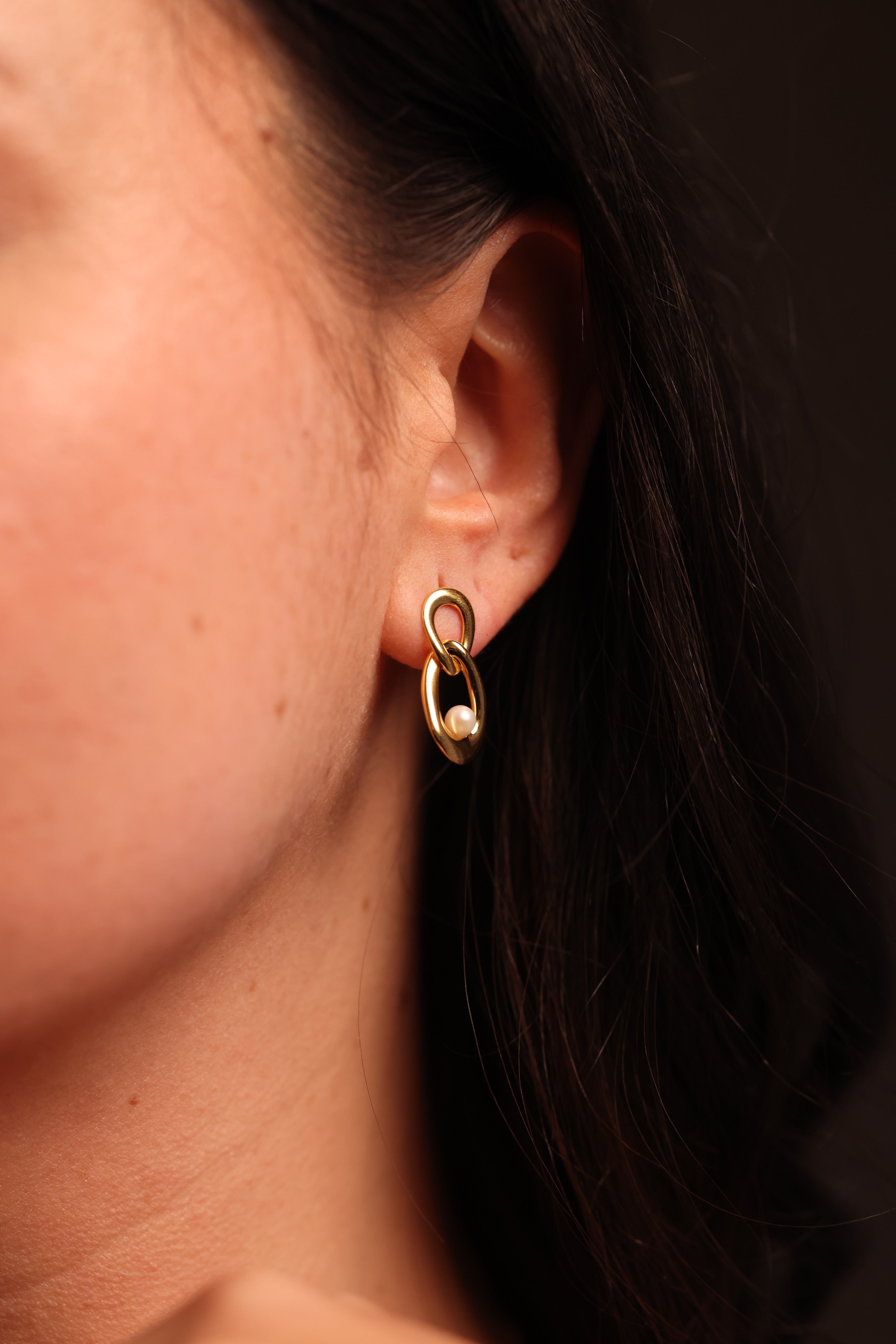 Yukti Earring with two connected open oval forms in a refined, modern design