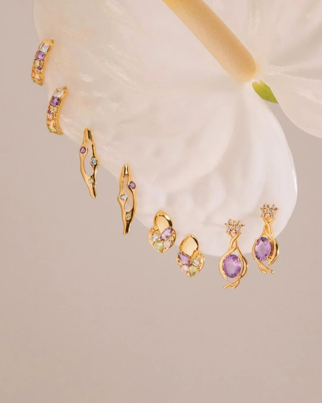 Ankura Earrings gold stem with irregular stones mid-growth design