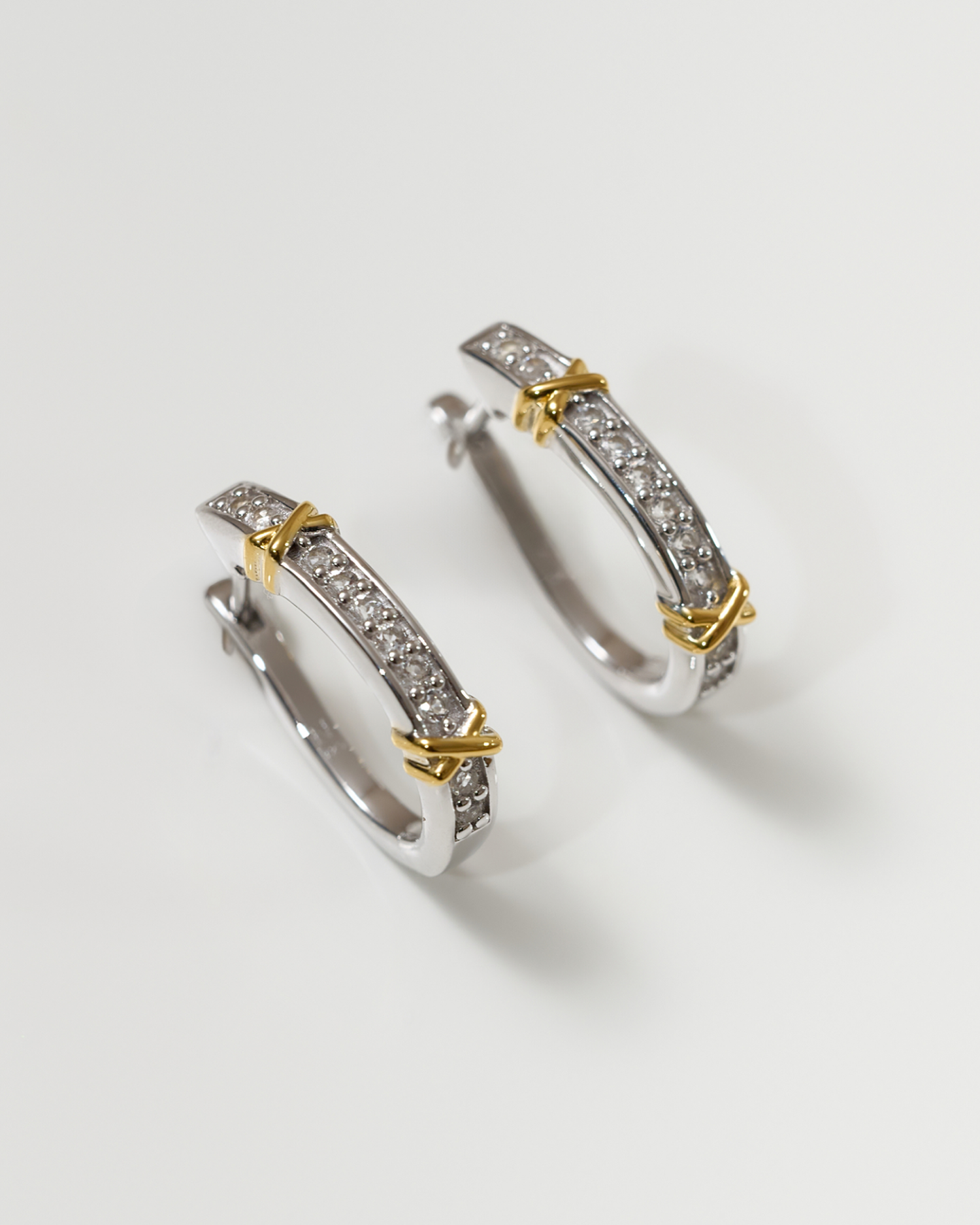 Aarvi Hoops gold earrings with pavé white topaz stones and unique curved design