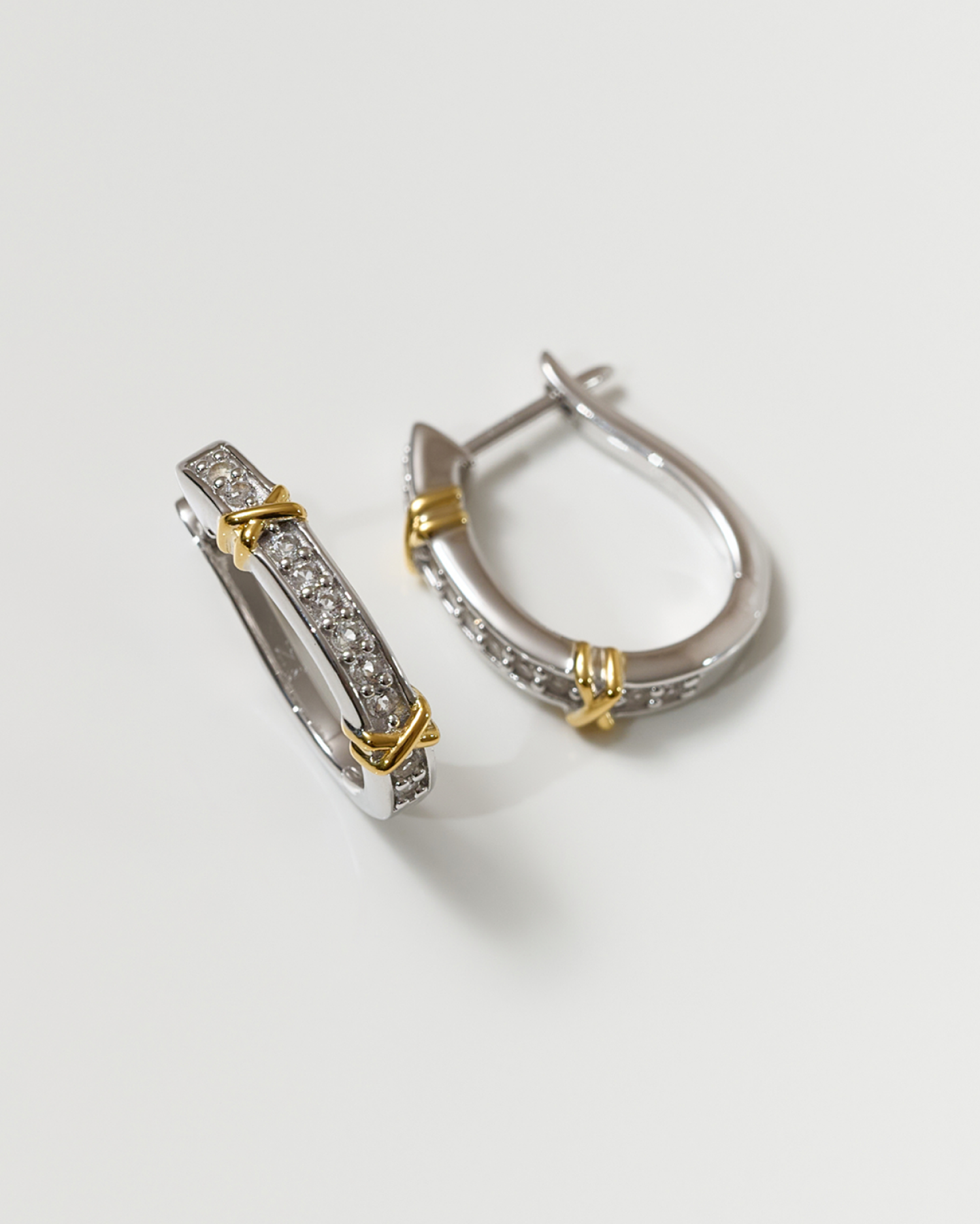 Aarvi Hoops gold and silver curved earrings with pavé white topaz stones