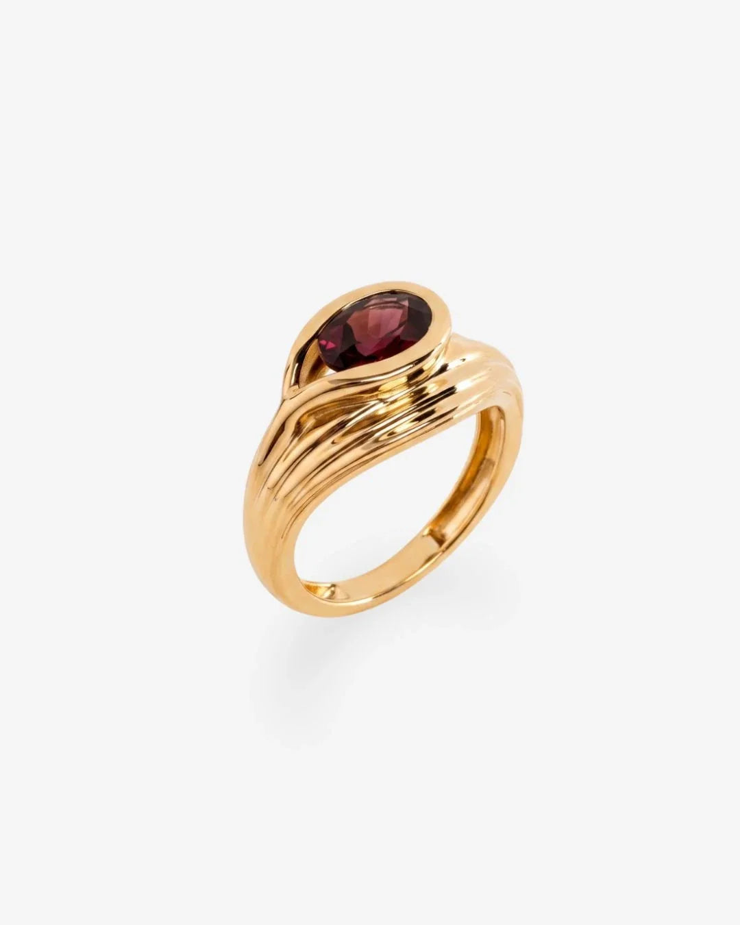 Korak Ring gold bud design with deep garnet stone symbolizing potential