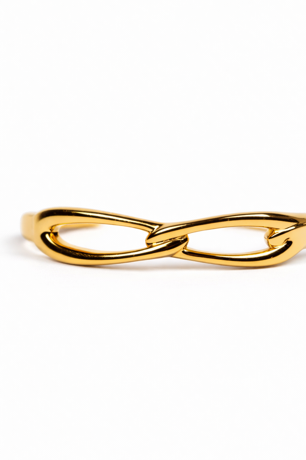 Kadi Cuff sculptural gold bracelet with interlinked forms and open modern design
