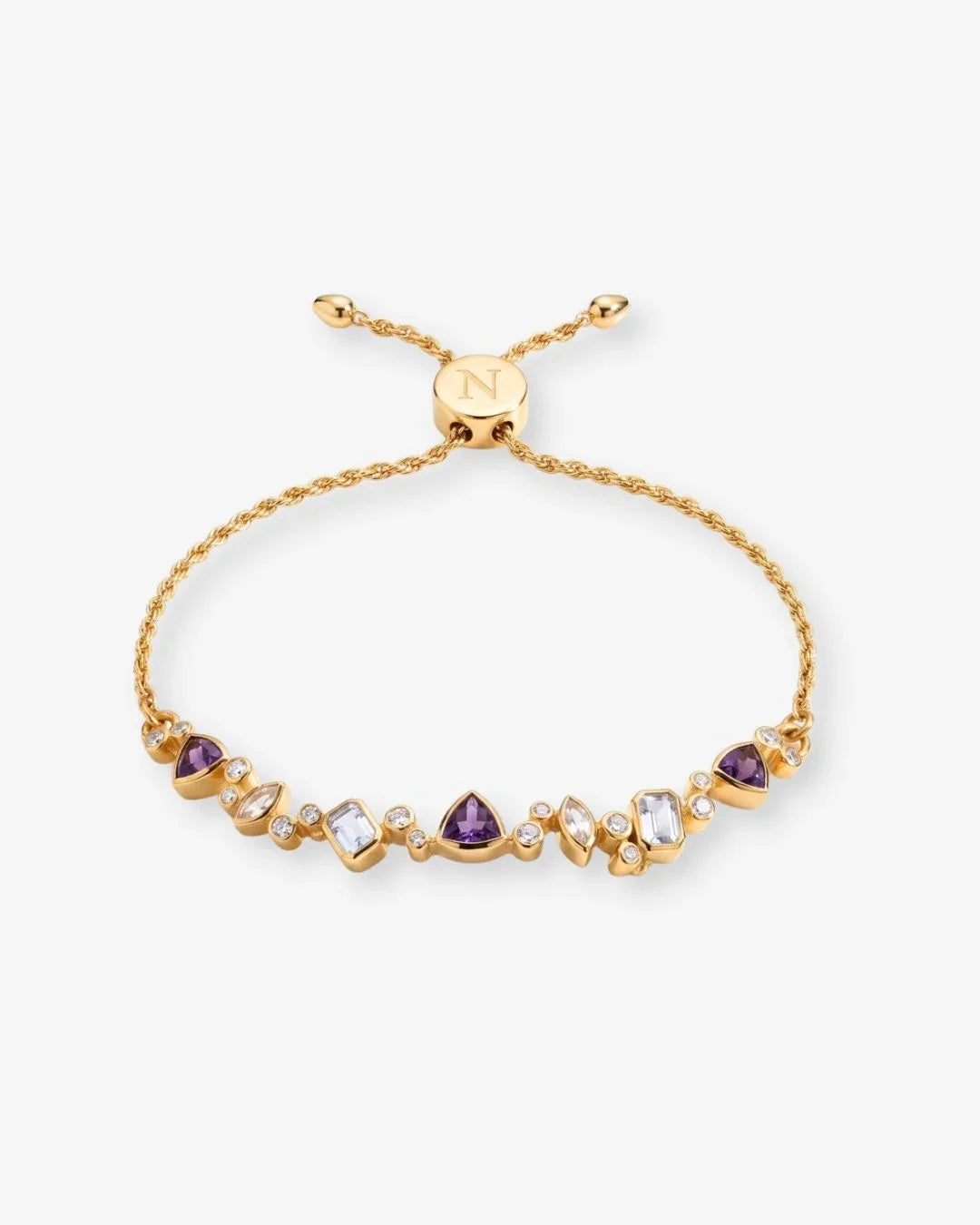 Mala bracelet with aquamarine, amethyst, rose quartz, and white topaz beads arranged like a floral garland on wrist