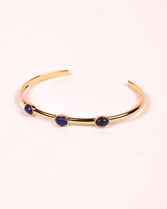 Trivena Cuff with three deep blue Lapis Lazuli stones set in a minimal gold framework for grounded elegance