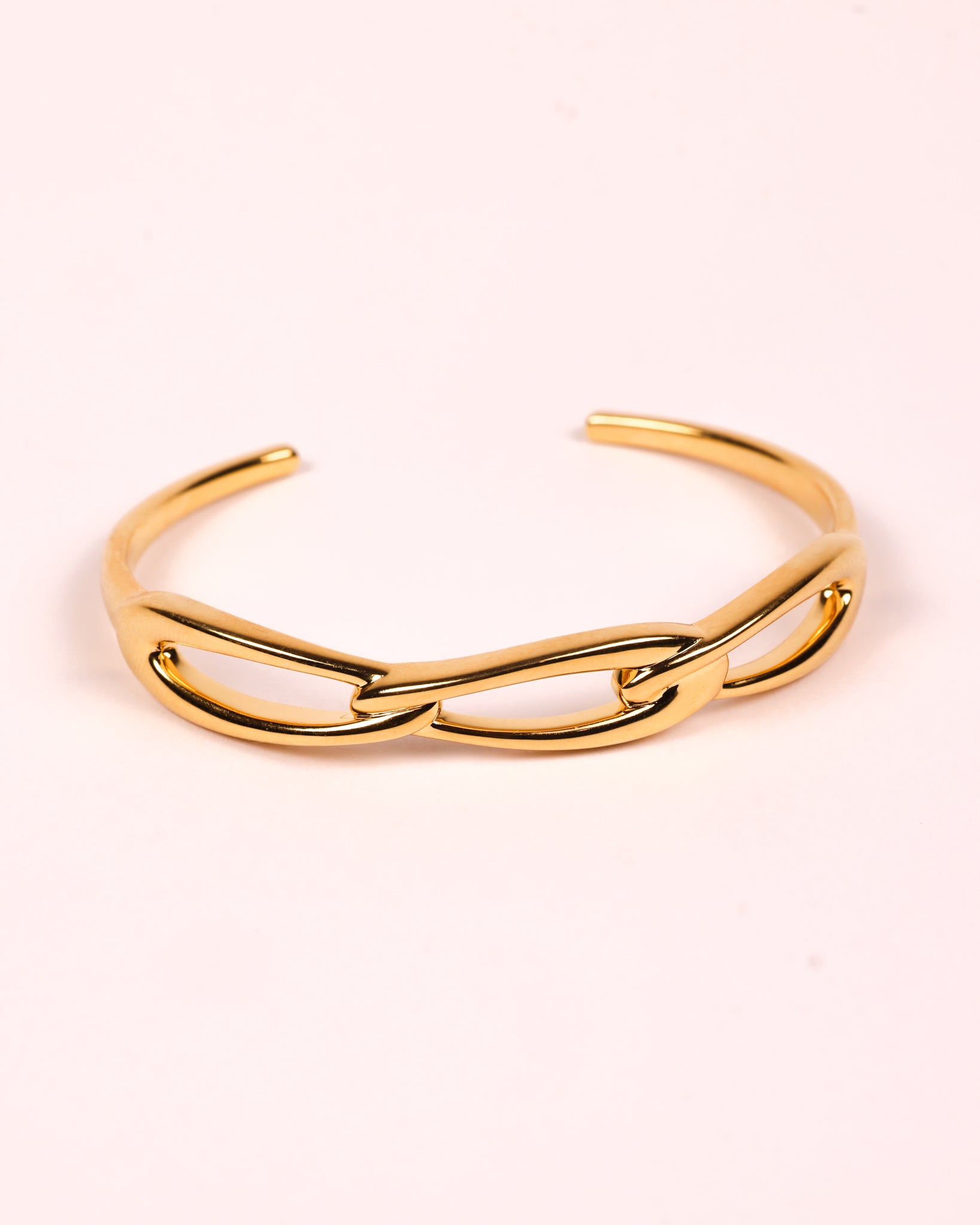 Kadi Cuff sculptural gold cuff with interlinked forms and open contemporary design