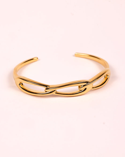 Kadi Cuff sculptural gold cuff with interlinked forms and open contemporary design
