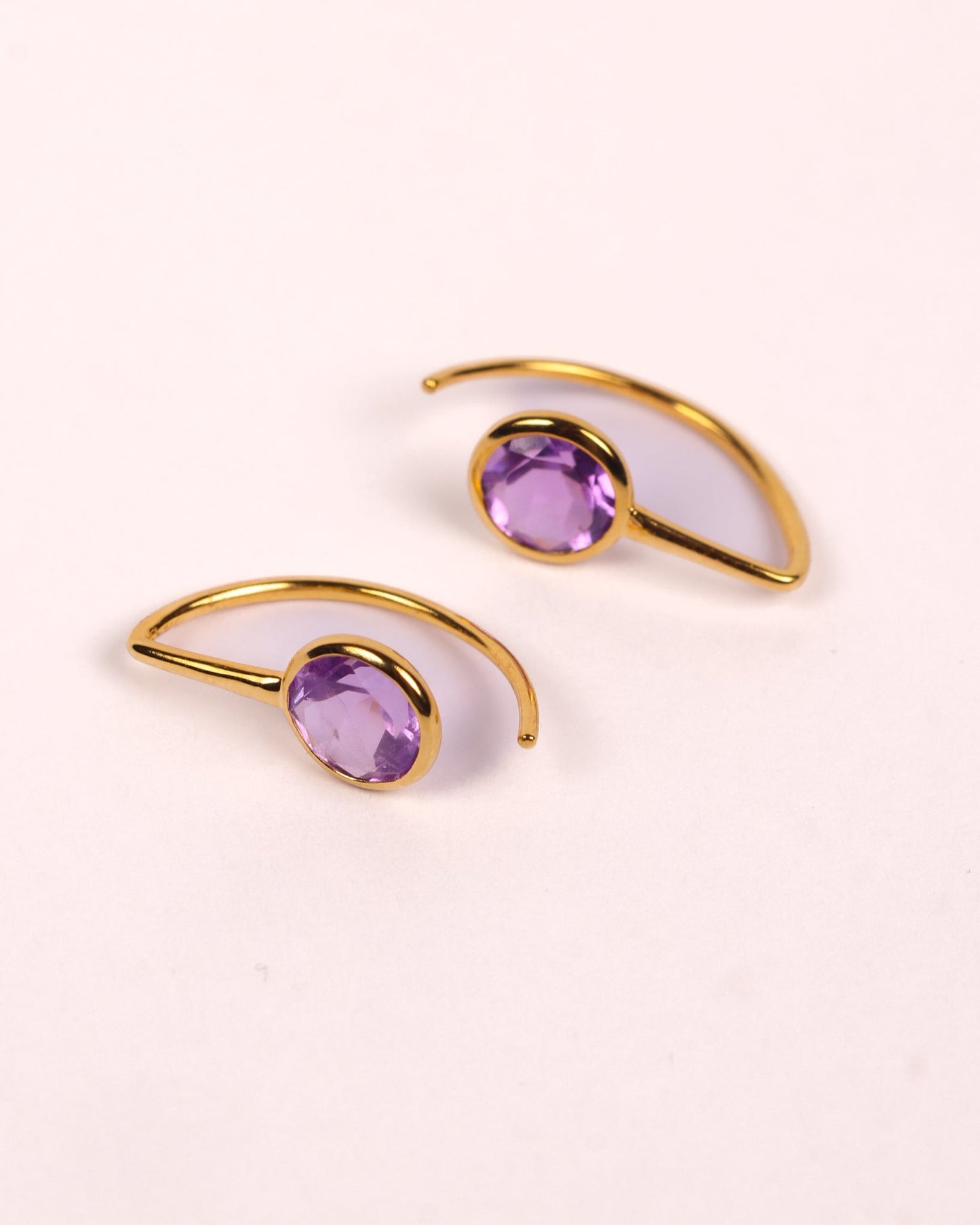Manvi Earrings with brilliant cut amethyst stones in a refined, minimal design showcasing violet hue and modern femininity