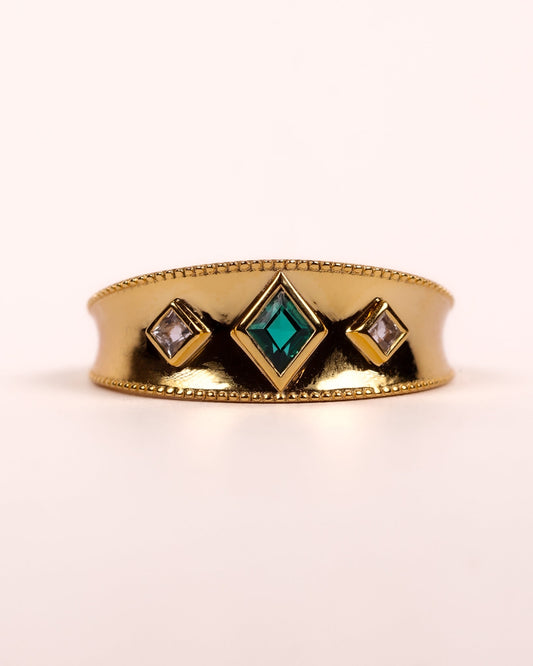 Harita Ring with lab-grown emerald center and white topaz accents in gold setting