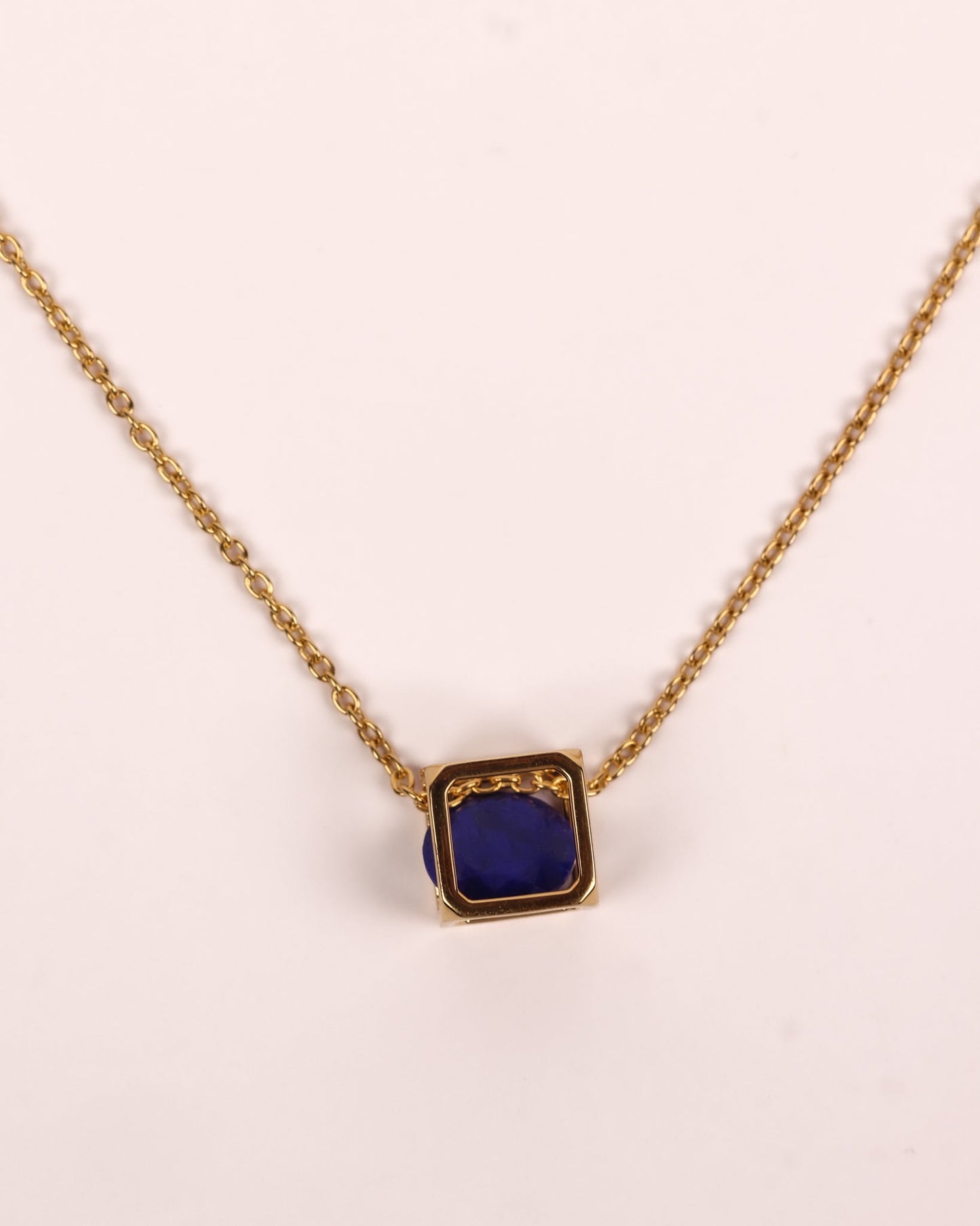 Kosha Necklace with round lapis lazuli stone in gold square frame, modern talisman design