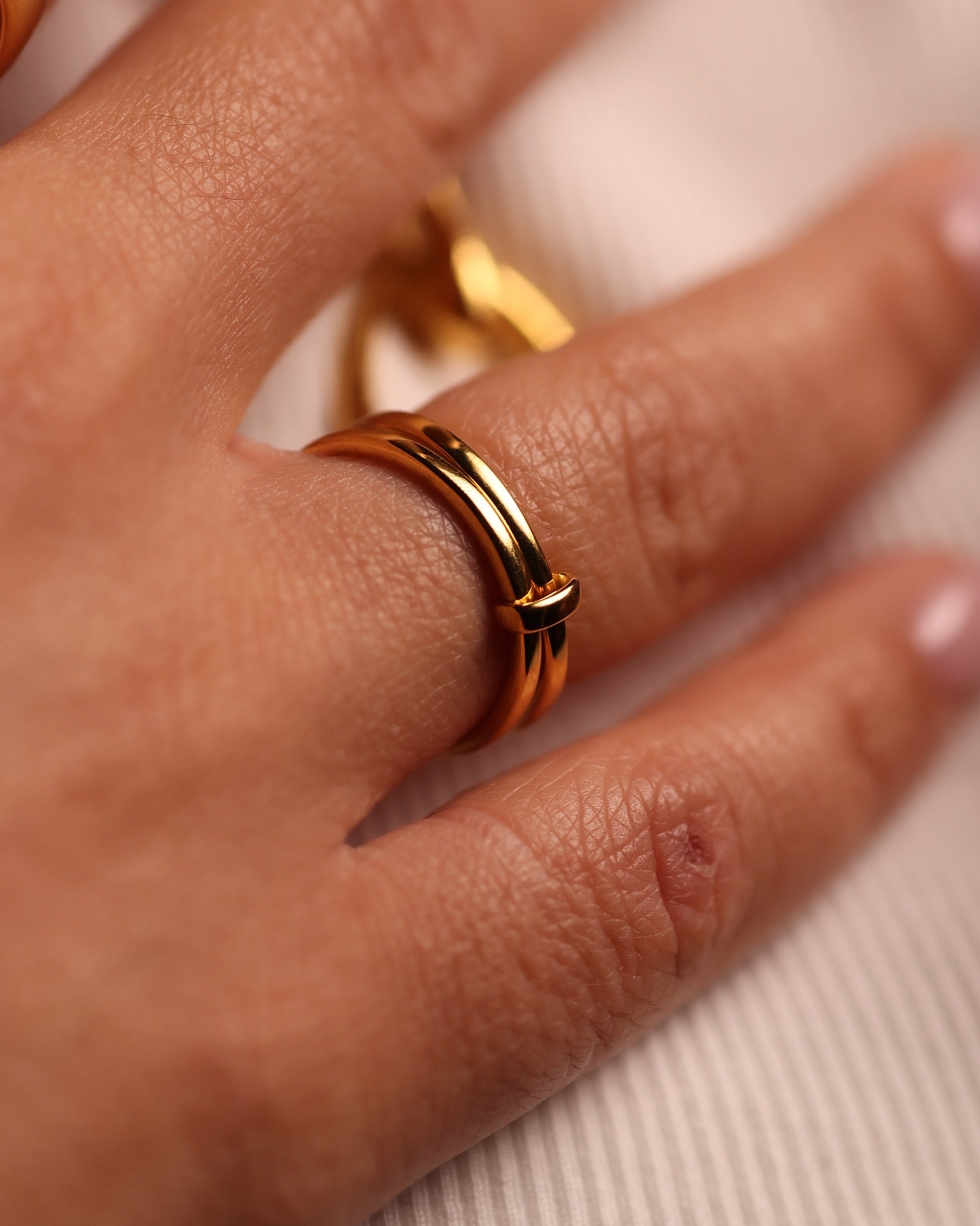Yugal Ring with two sculptural rings joined by a single loop showcasing modern unity and balance