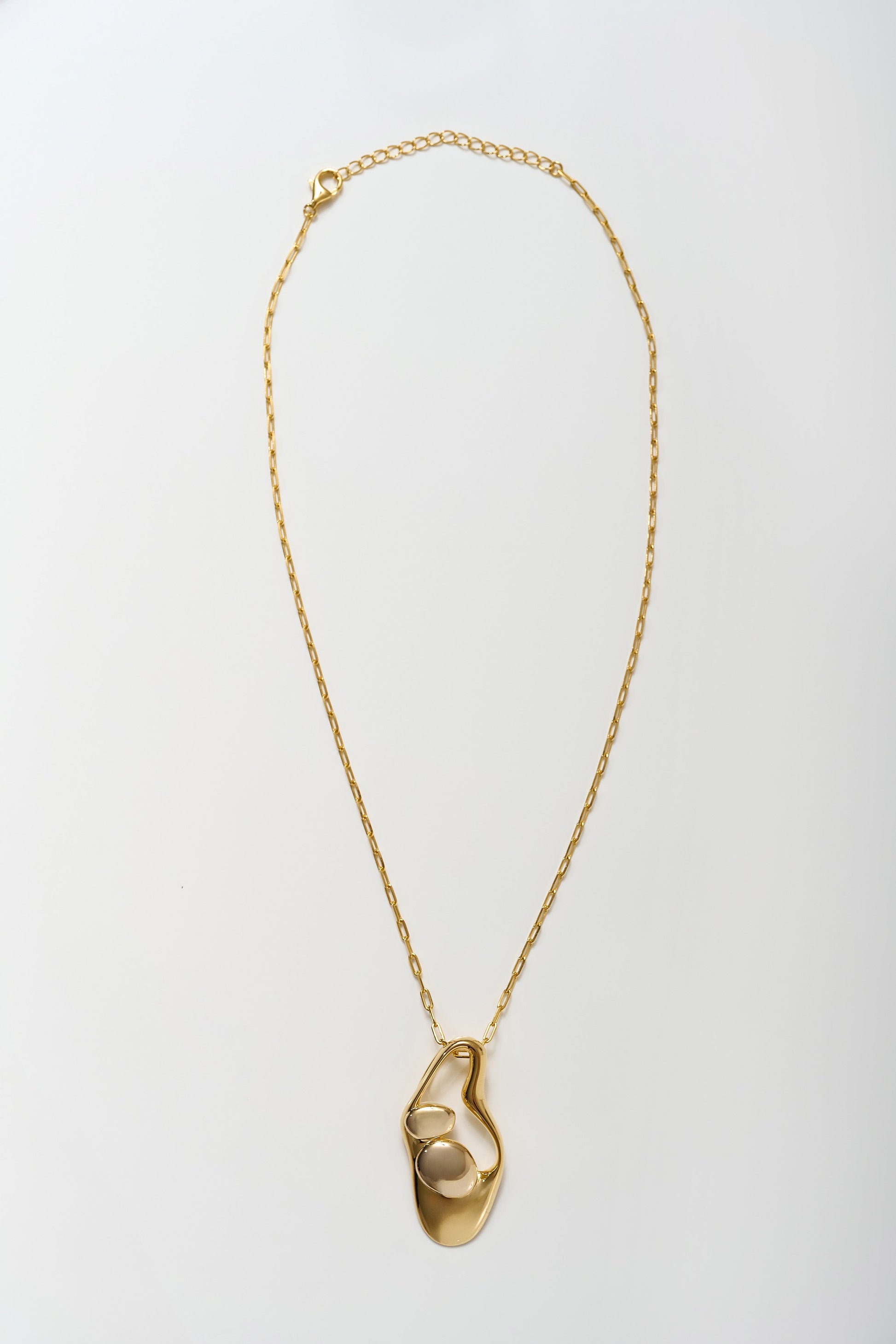 Minimalist Aakar Necklace in fluid gold with abstract sculpted pendant design