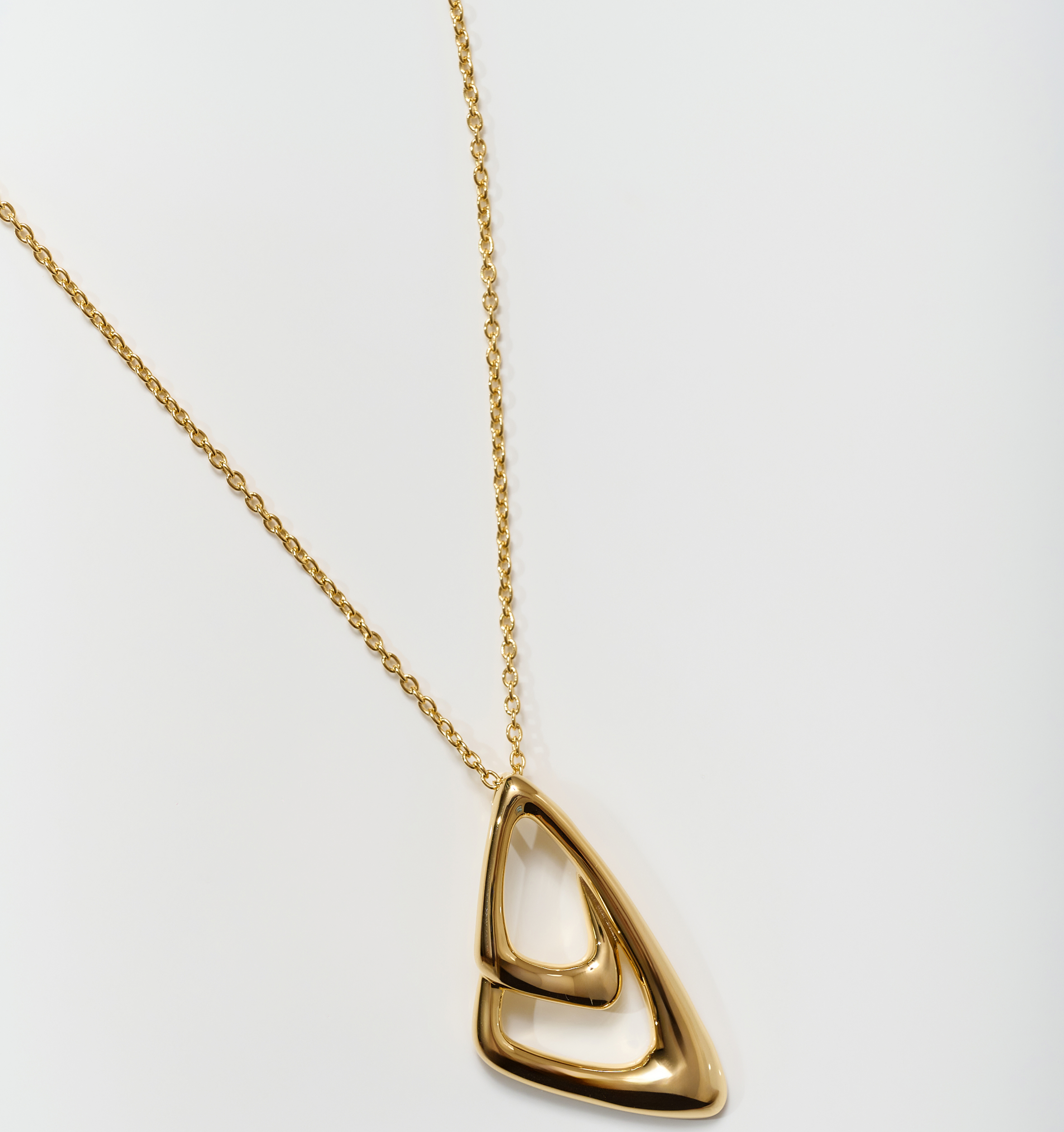 Aavrit Necklace gold pendant with elegant curved design on delicate chain