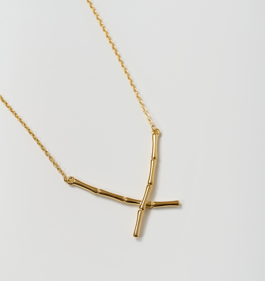 Vansh Necklace with intersecting golden stems symbolizing lineage and strength
