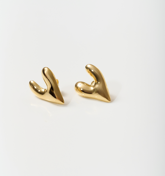 Gold-toned silver heart-shaped Avara Earrings with an uneven, sculptural, and raw organic finish