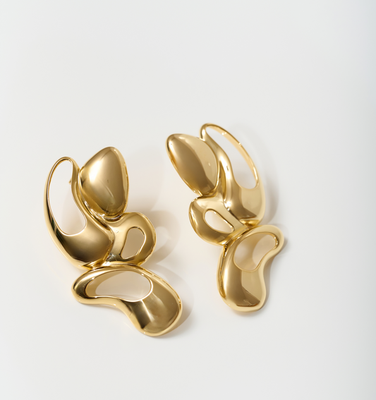 Radiant gold Nutya Earrings with fluid, sculptural design inspired by dance motion