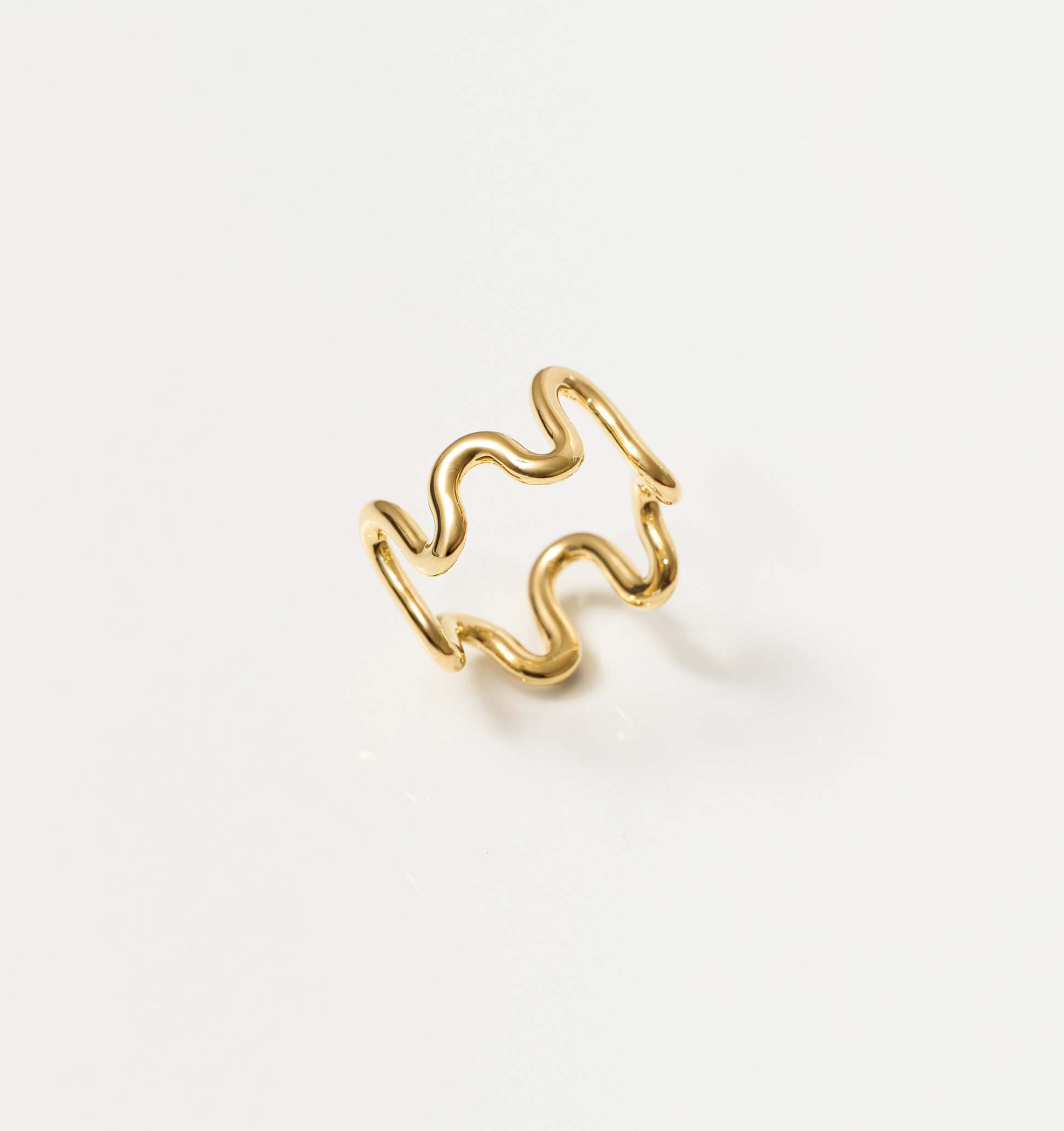 Gold Neer Ring with wavy ripple design inspired by water motion