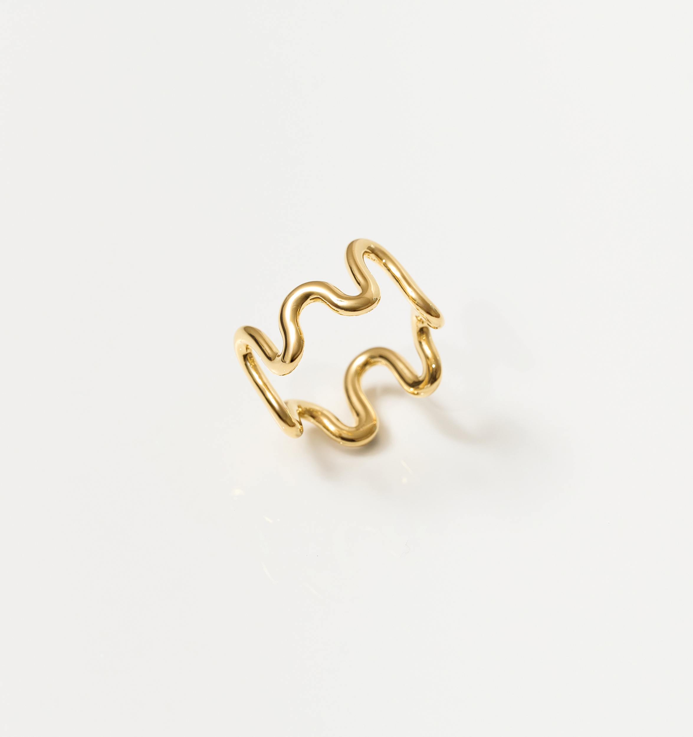 Gold Neer Ring with wavy ripple design inspired by water motion