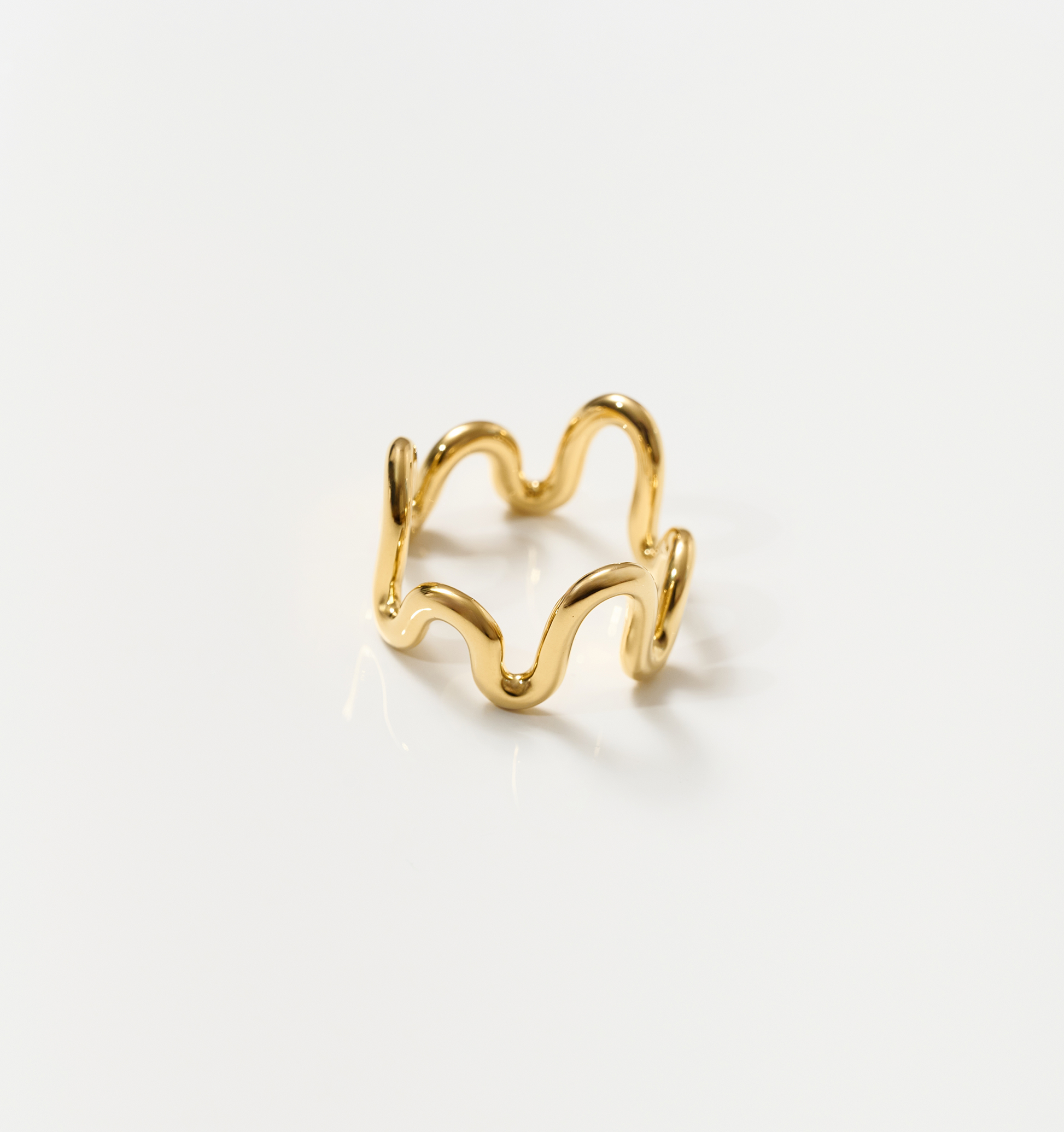 Neer Ring gold ripple design jewelry shaped like frozen water curve