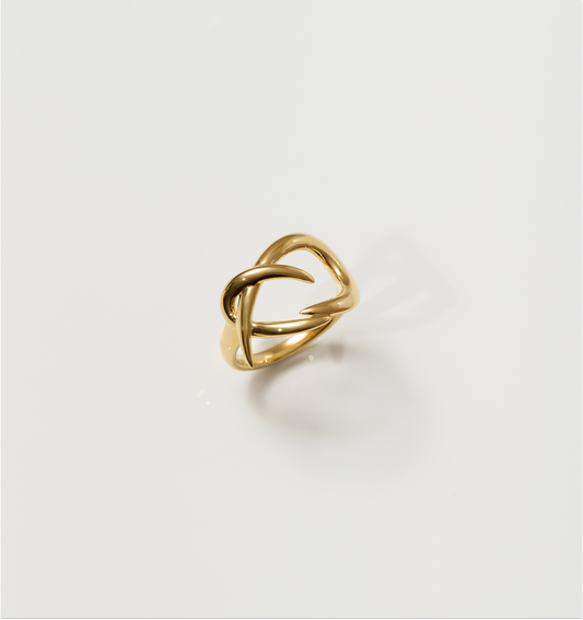 Karvat Ring gold sculpted ring with intertwined curves symbolizing tension and grace