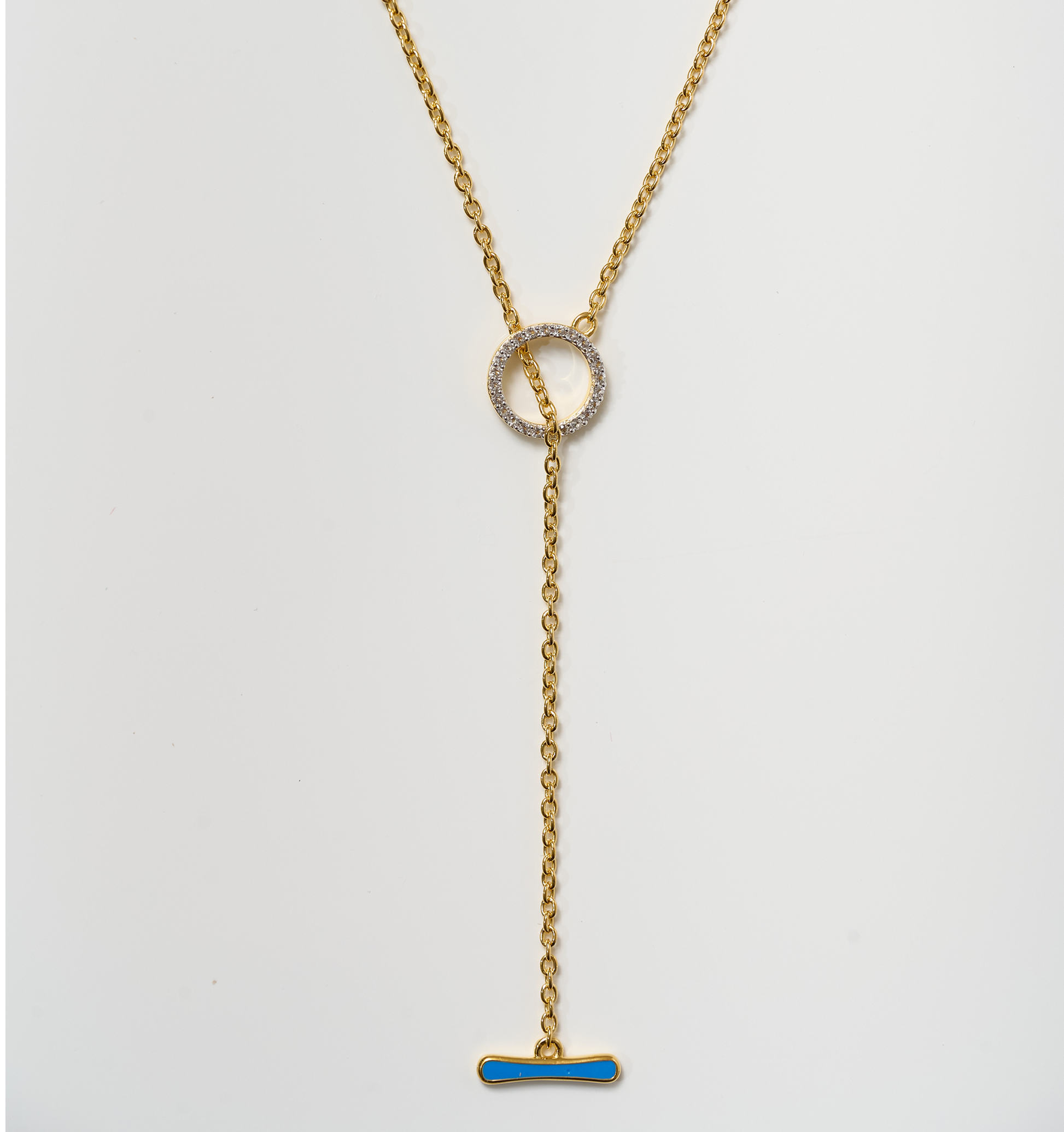Orya Necklace gold chain with white topaz circle and blue bar pendant design