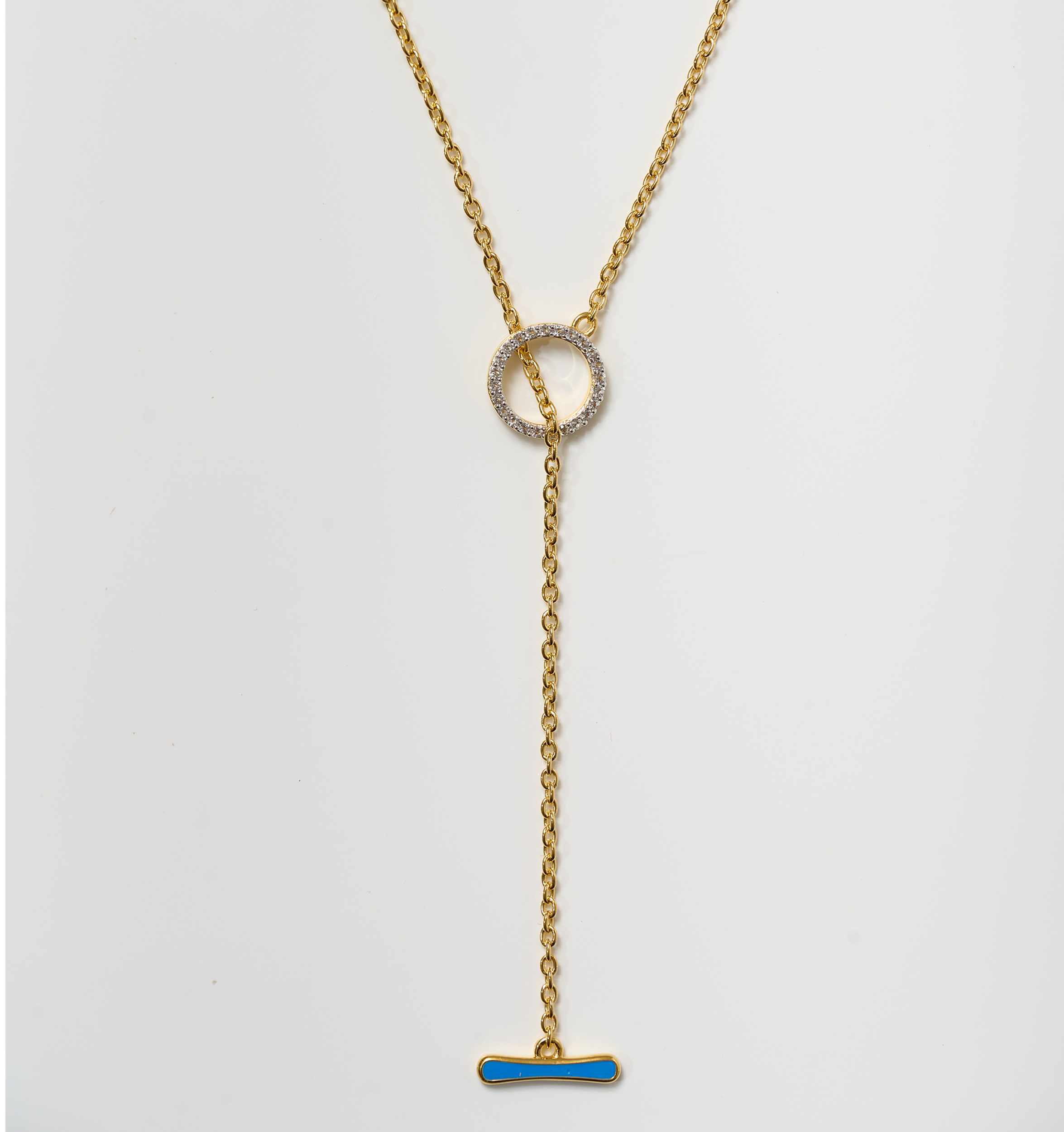 Orya Necklace gold chain with white topaz circle and blue bar pendant design