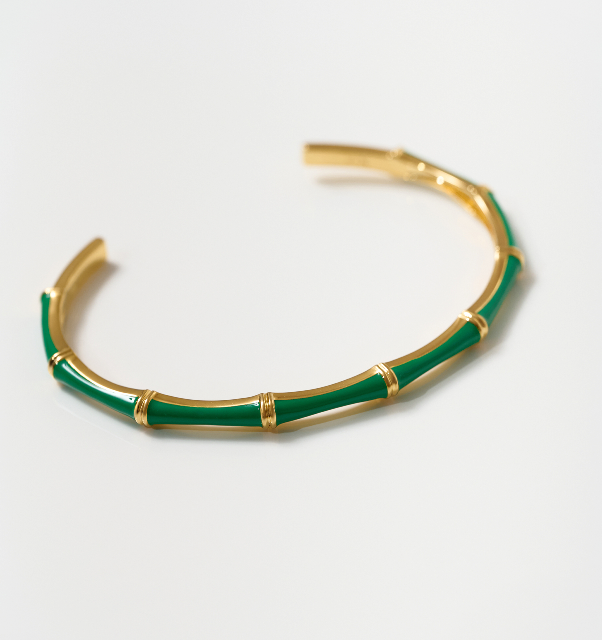 Baana Cuff gold bamboo-inspired bracelet with green enamel segments