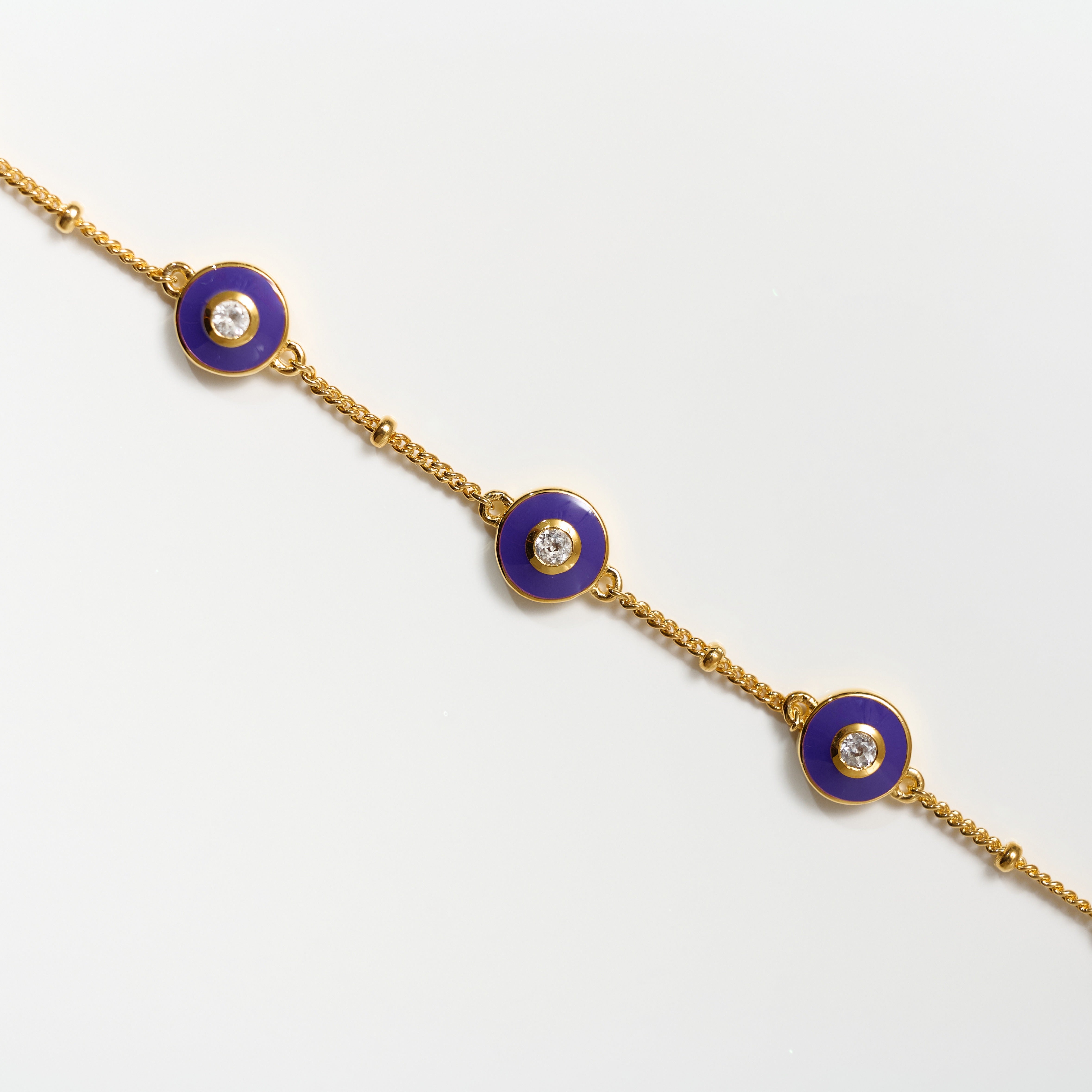 Viraah Bracelet with violet enamel and white topaz on gold chain