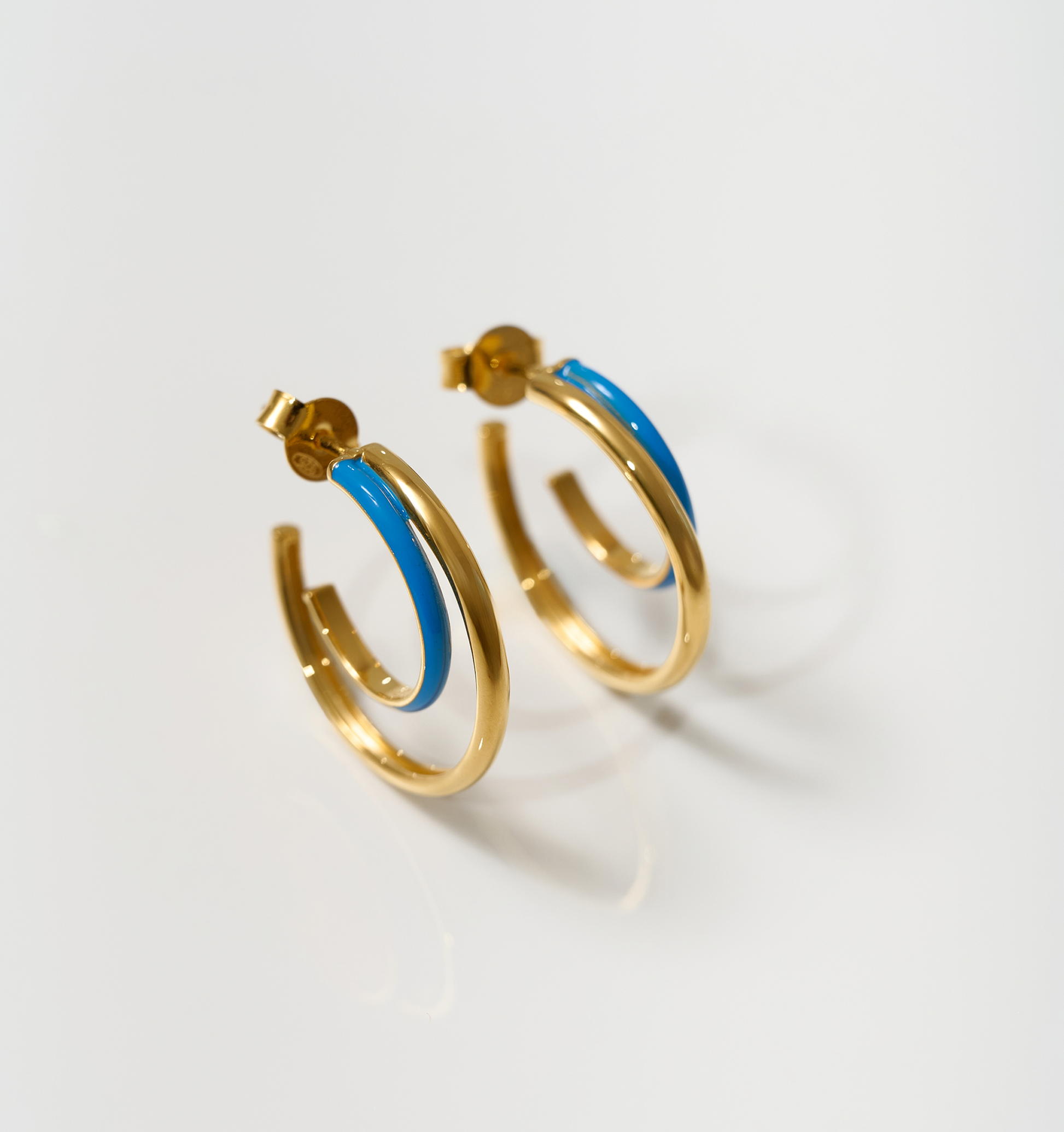 Gold hoop earrings with turquoise enamel detailing, Soma Hoops crescent design