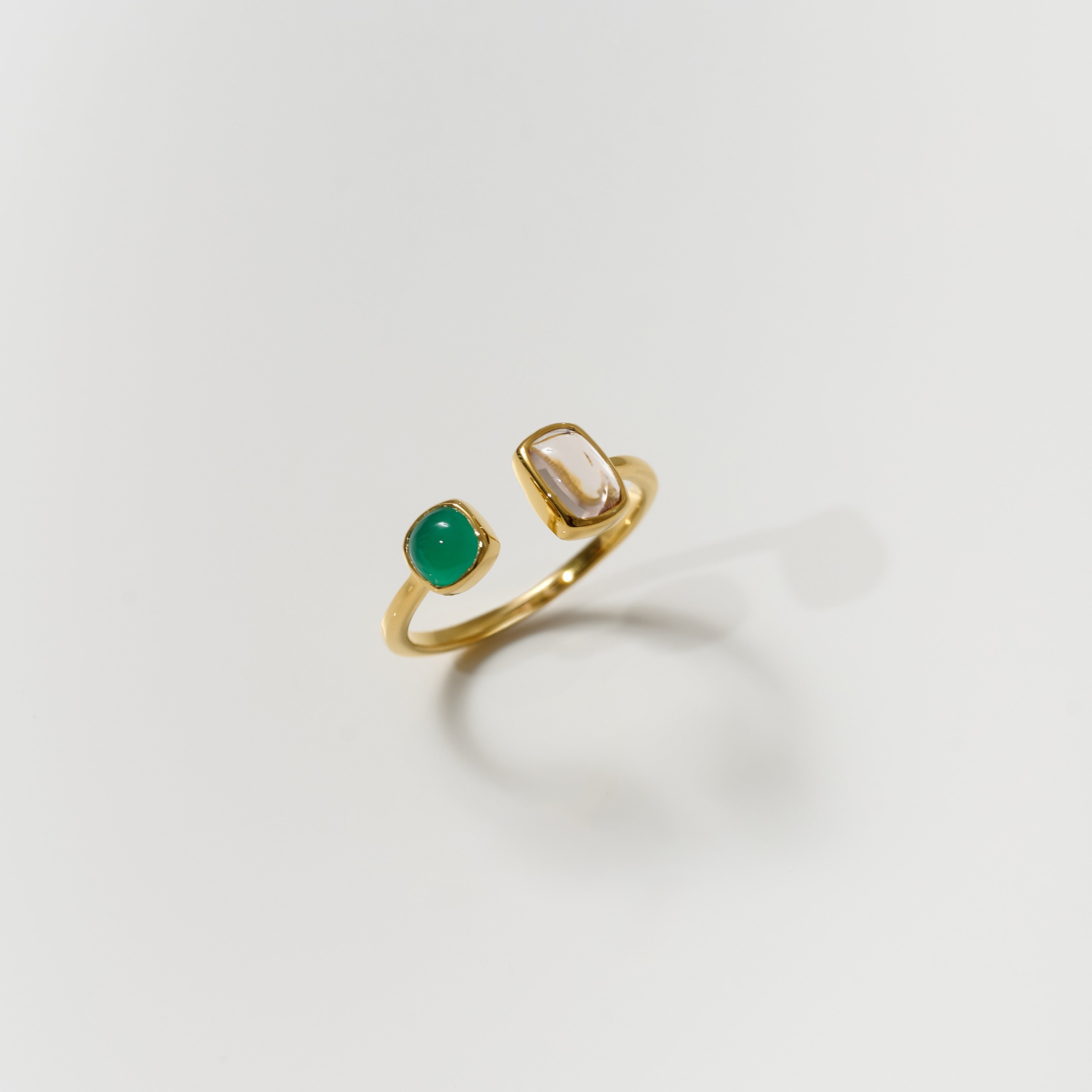 Tulaa Ring with gold band featuring green onyx and morganite gemstones balancing clarity and grace