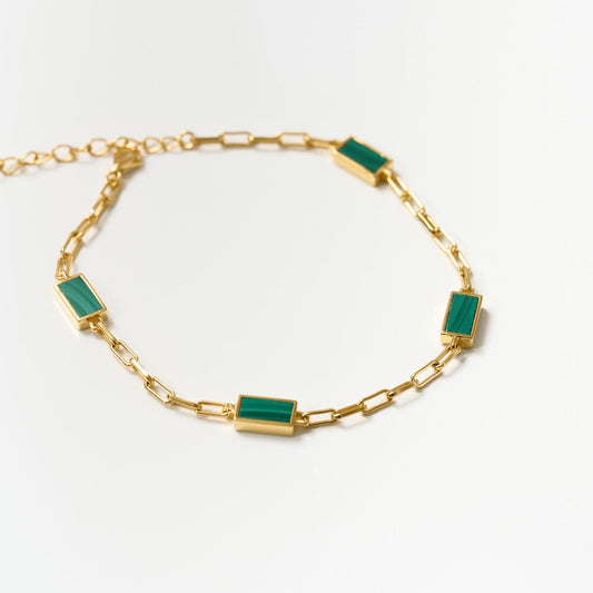 Gold Mann Bracelet with rectangular green stone accents and delicate chain links