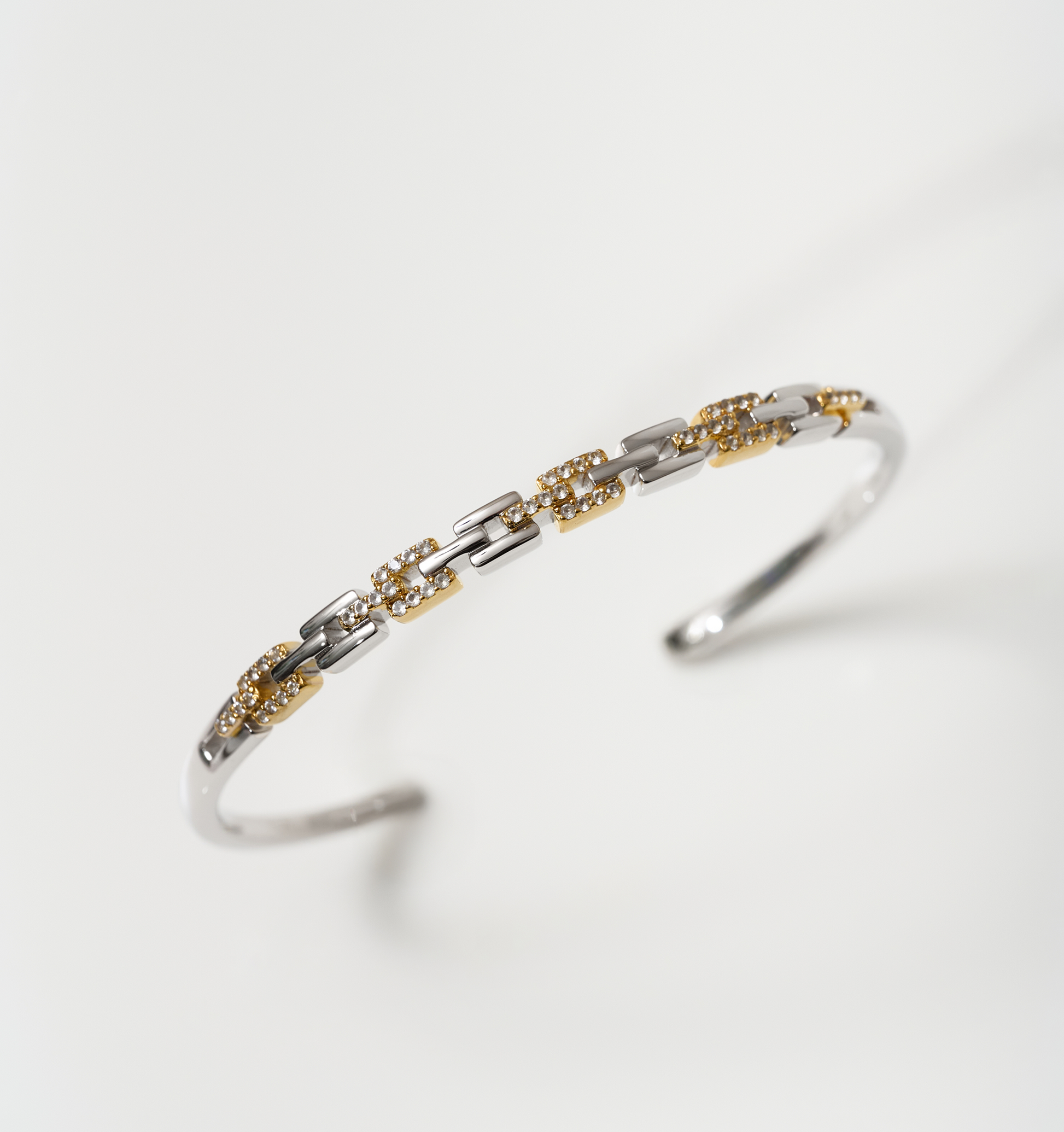 Noura Cuff gold and silver bracelet with 52 sparkling stones on wrist accessory