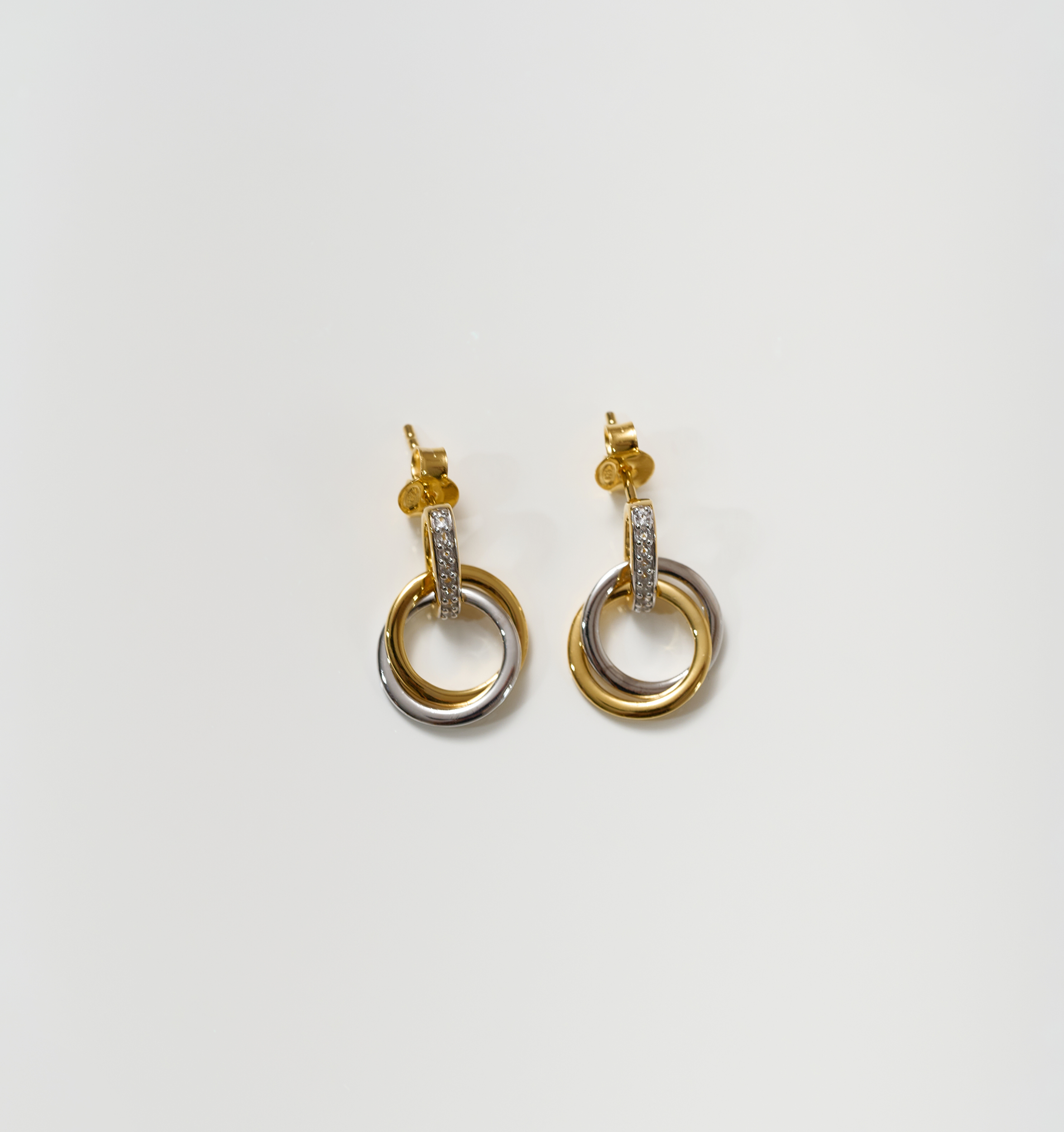 Nirya Earrings gold and silver rings with diamond accents in elegant design