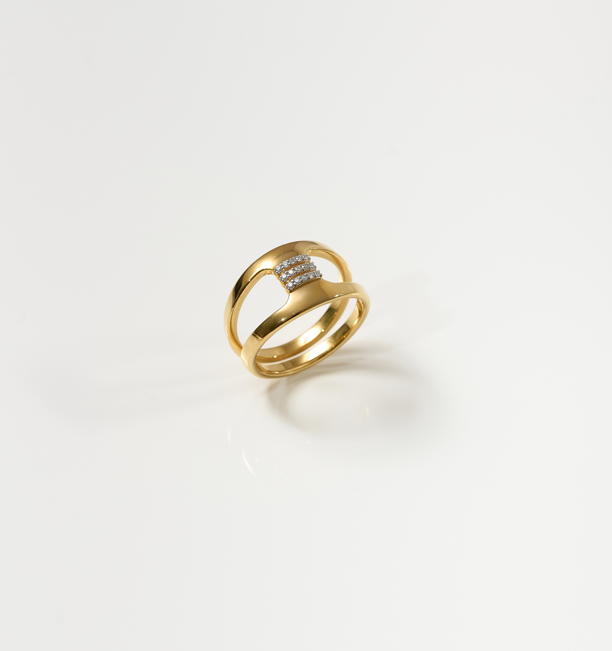 Setu Ring gold band with two arcs connected by white topaz bridge symbolizing clarity and connection