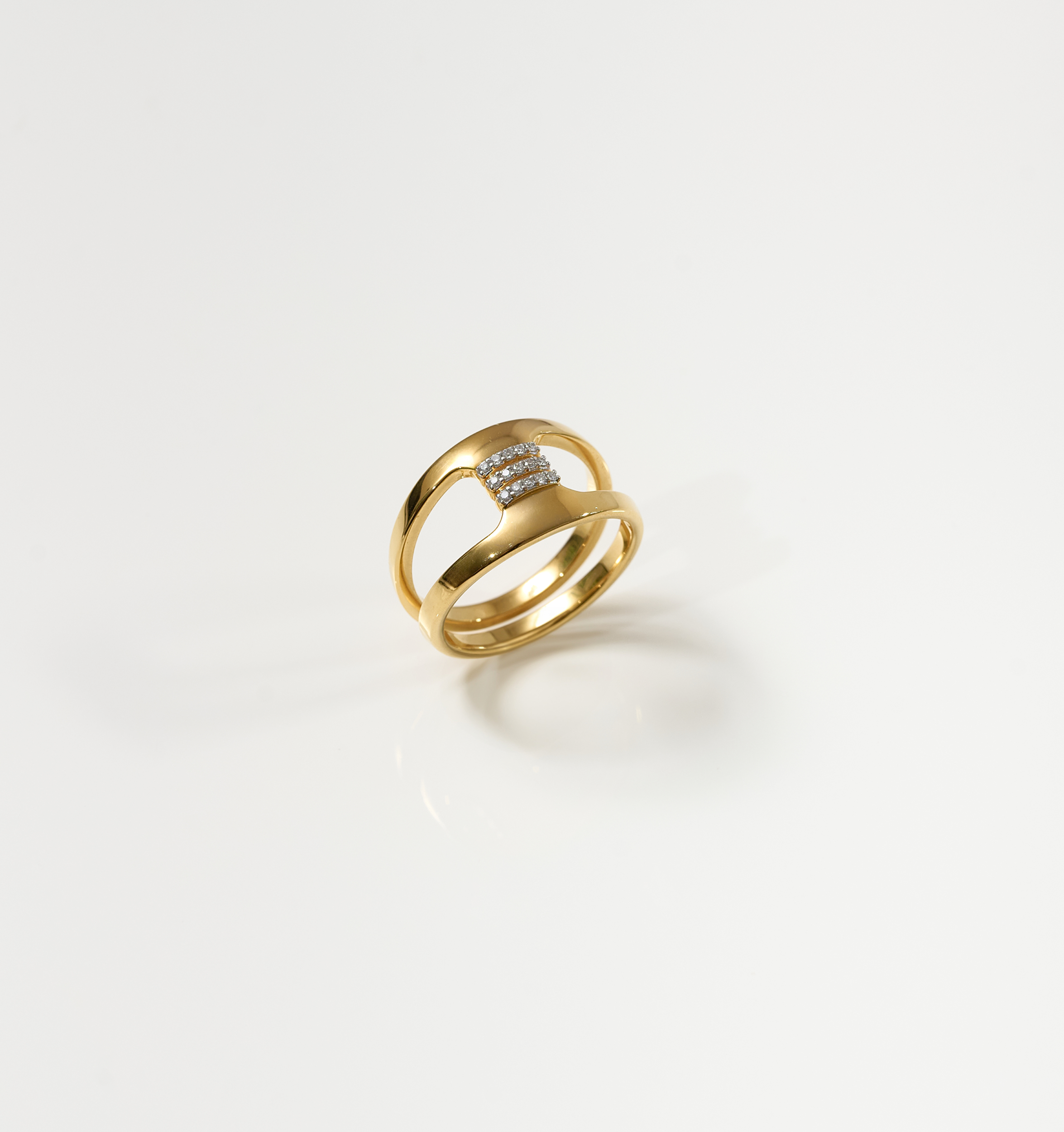 Setu Ring gold band with two arcs connected by white topaz bridge symbolizing clarity and connection