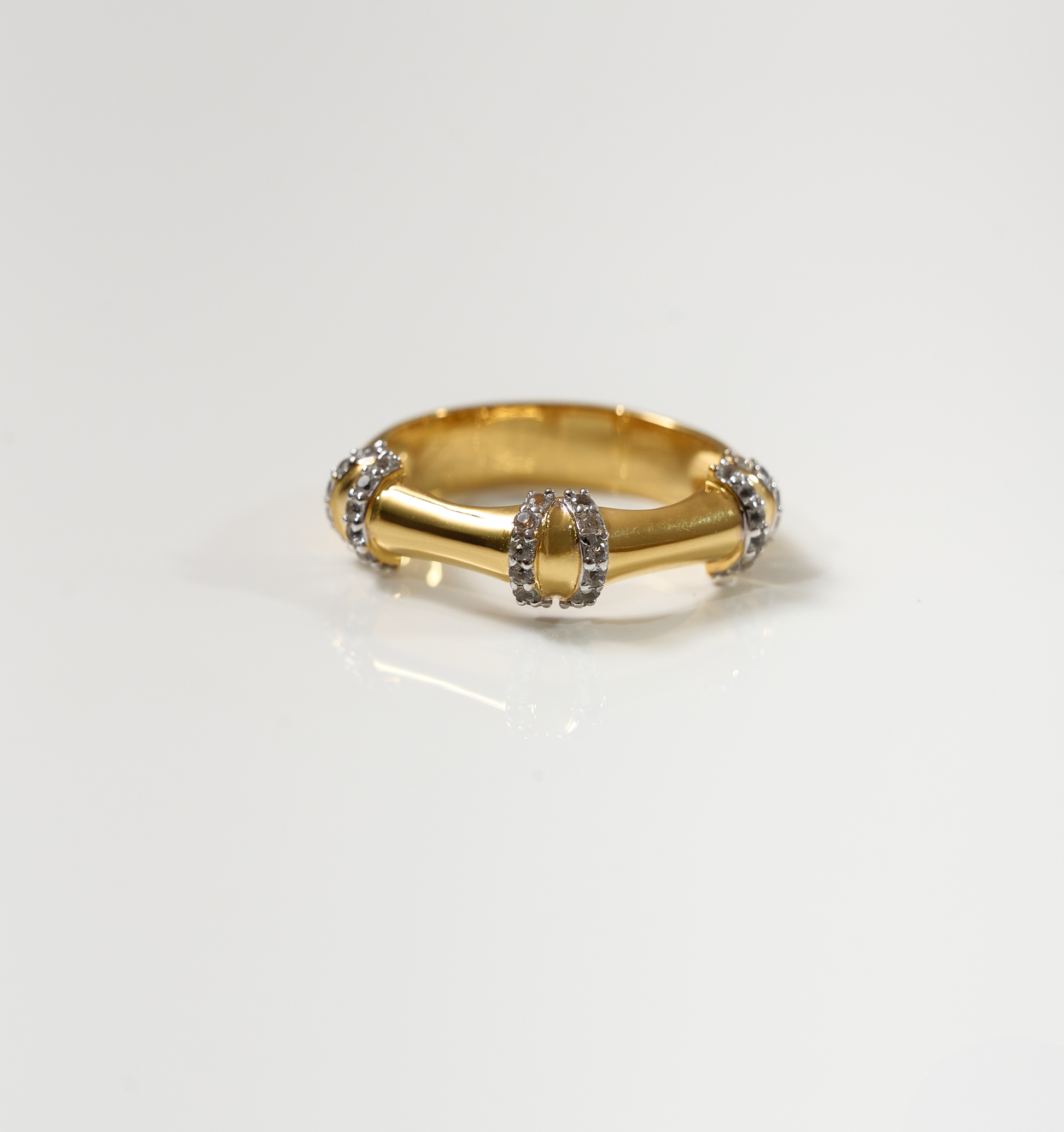 Ansh Ring gold with white topaz accents inspired by bamboo strength and geometric design