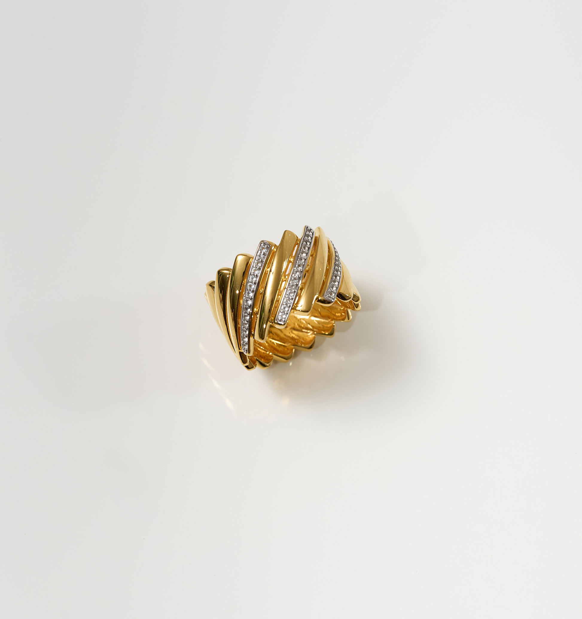 Gold Reya Ring with chevron curves and 42 white topaz stones