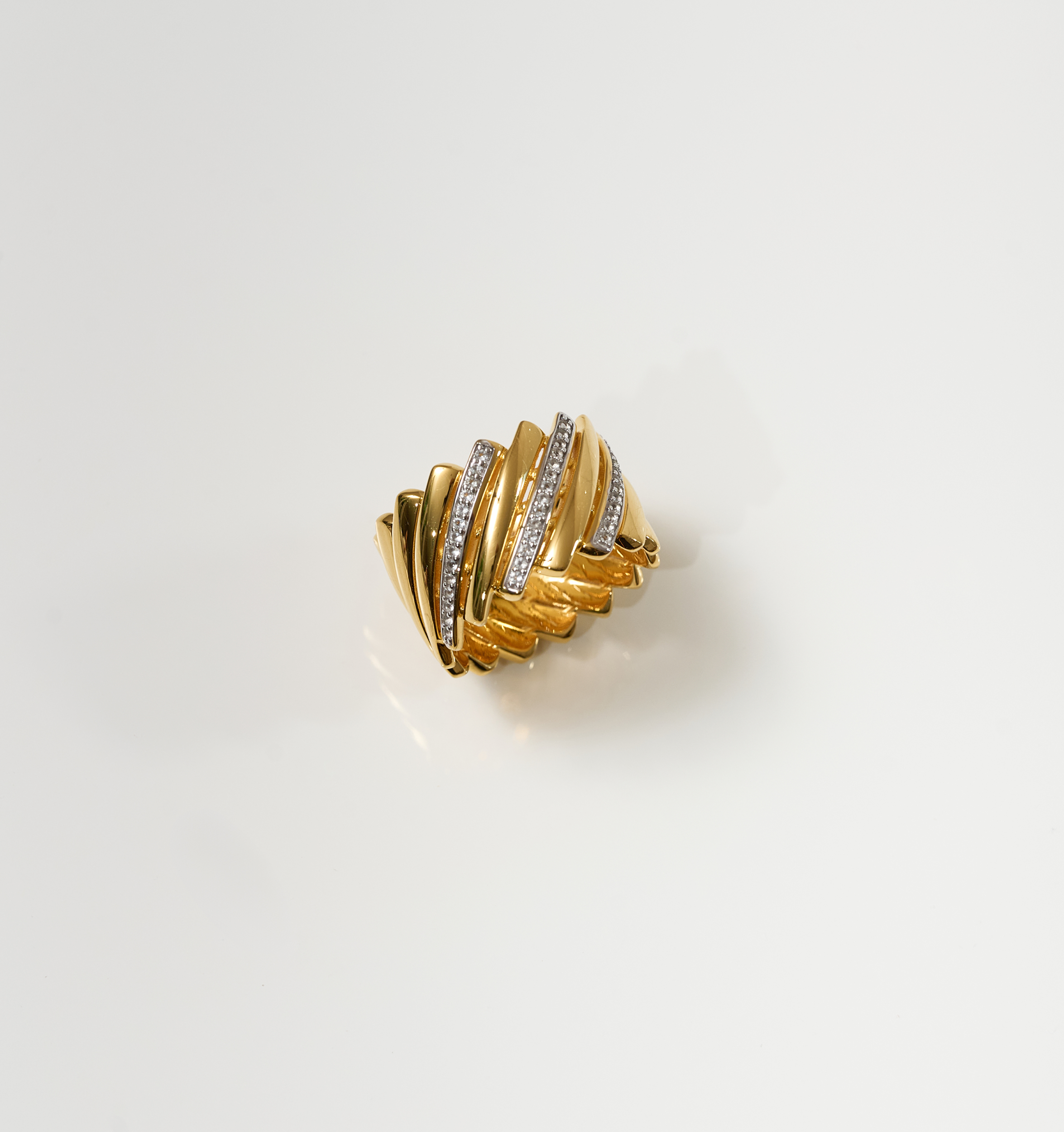 Gold Reya Ring with chevron curves and 42 white topaz stones