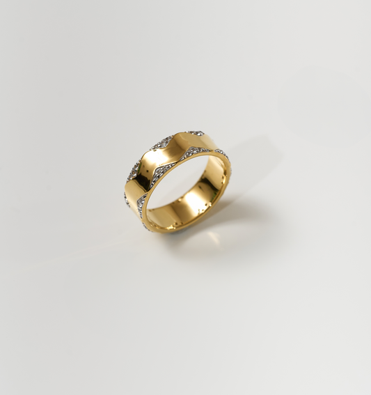 Vedya Ring gold sculpted curves with white topaz accents on reflective surface