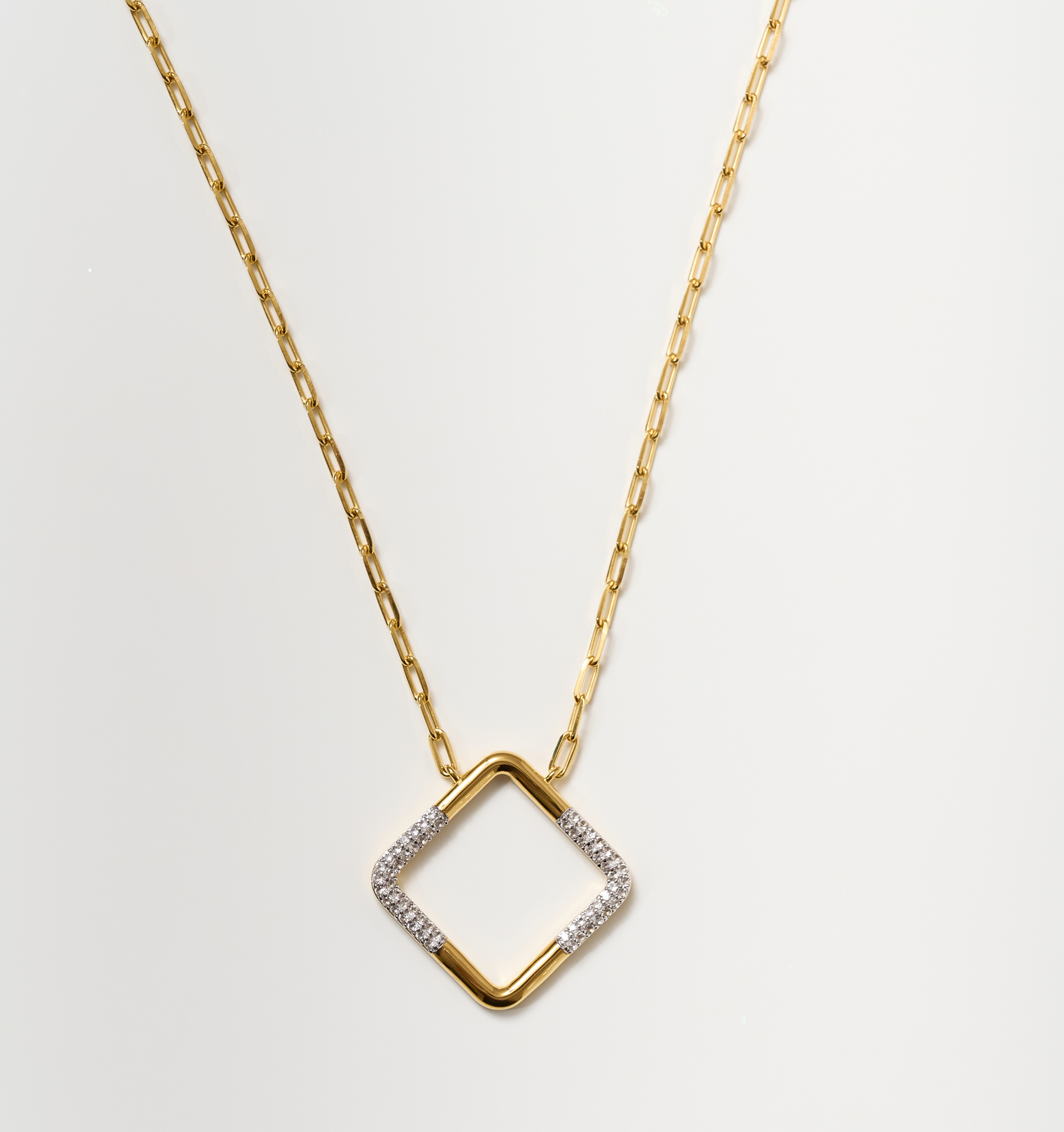 Trayi Necklace gold chain with diamond-studded square pendant and white topaz accents