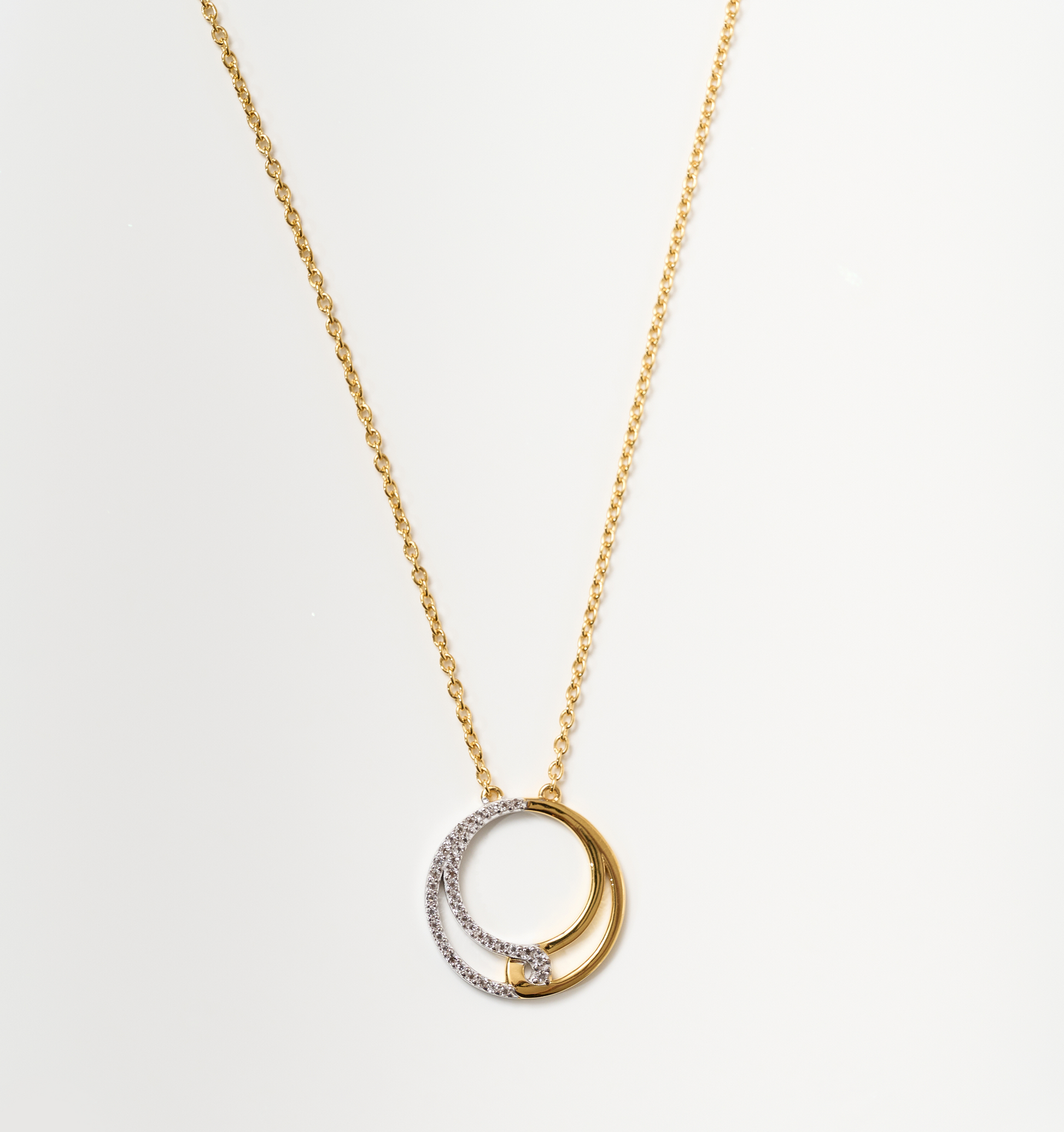 Nayra Necklace gold chain with intertwined silver and gold circles pendant symbolizing unity and strength