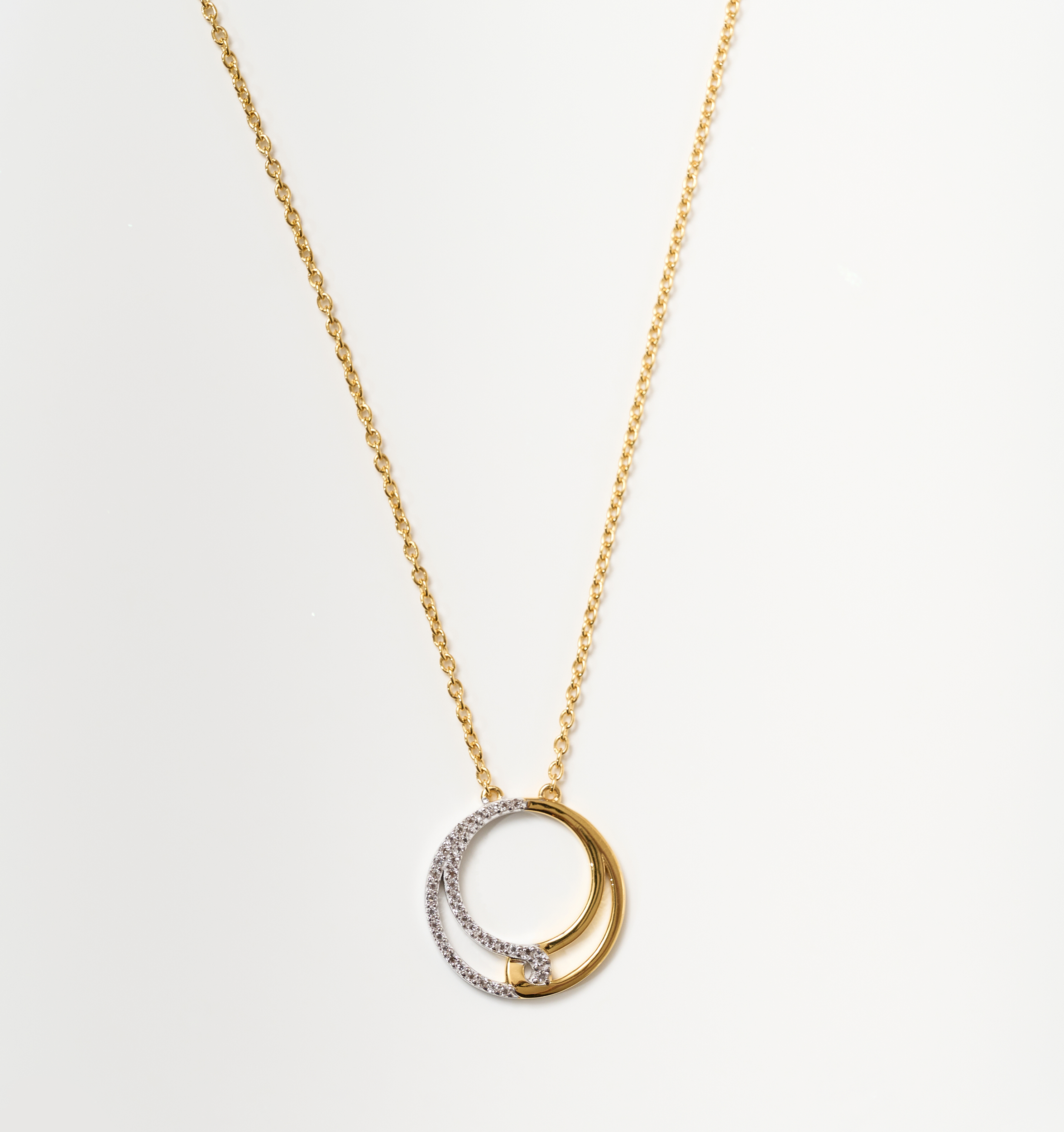 Nayra Necklace gold chain with intertwined silver and gold circles pendant symbolizing unity and strength