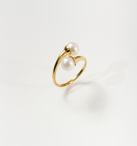 YugYagn Ring gold band with two pearls elegant design on white background