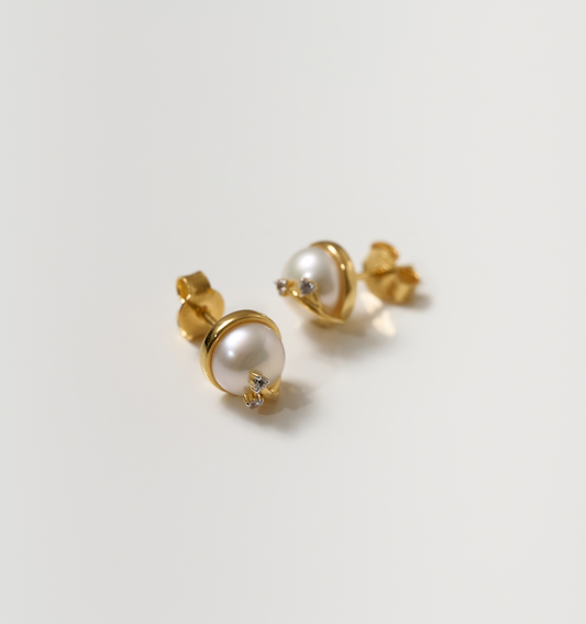 Poorna Earrings gold studs with pearl and star detailing symbolizing completeness and grace