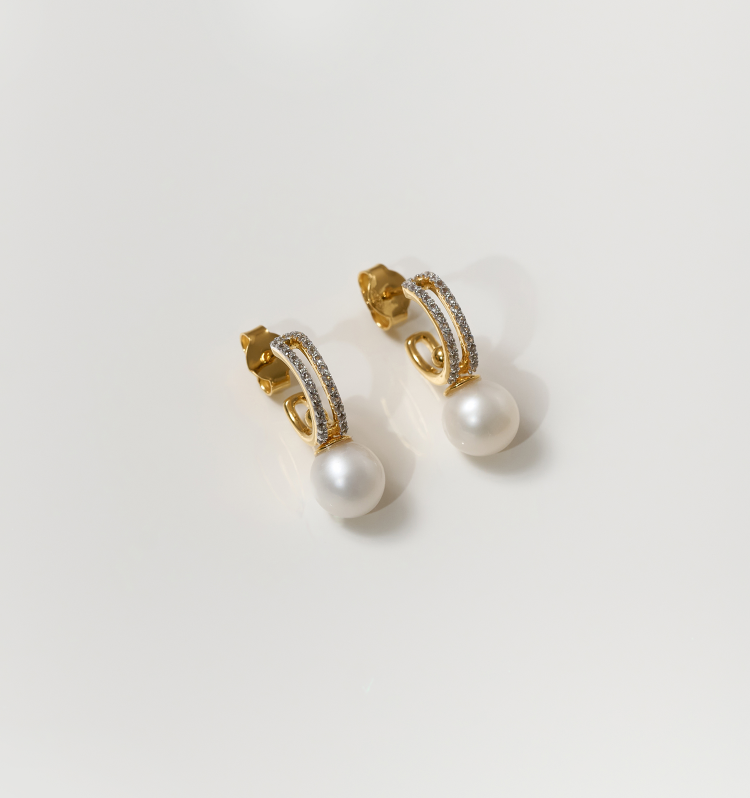 Gold Tarasa Earrings with pearl and star-inspired sparkling details