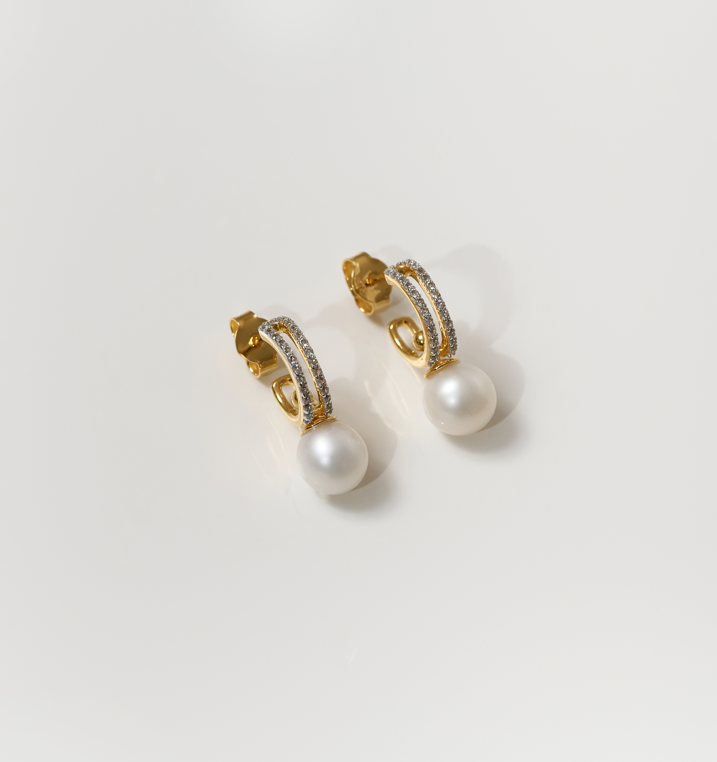 Gold Tarasa Earrings with pearl and star-inspired sparkling details
