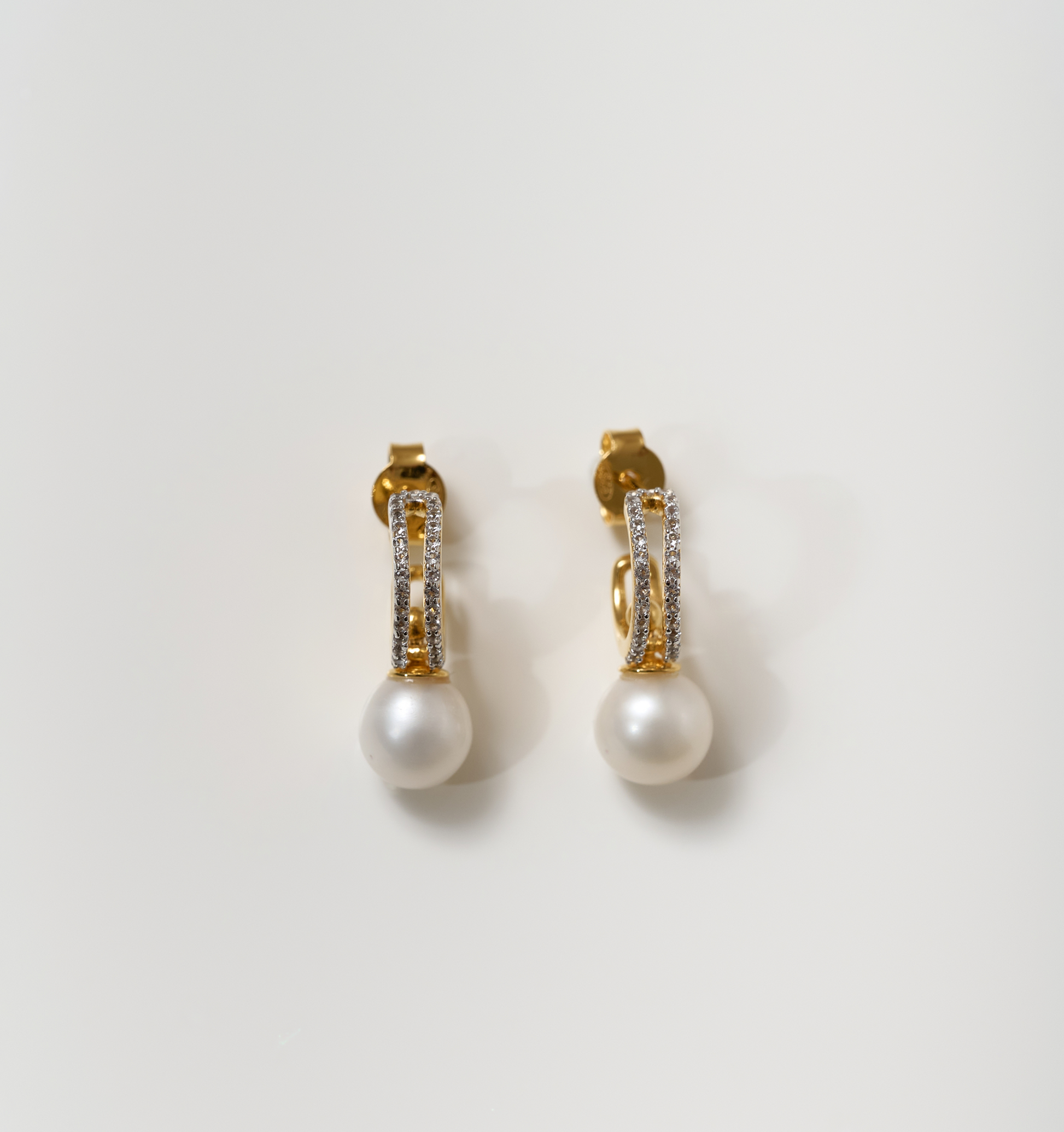Elegant gold Tarasa Earrings with pearls and sparkling stones design