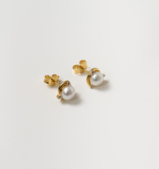 Nayana Earrings with single pearl and topaz set in gold stud design