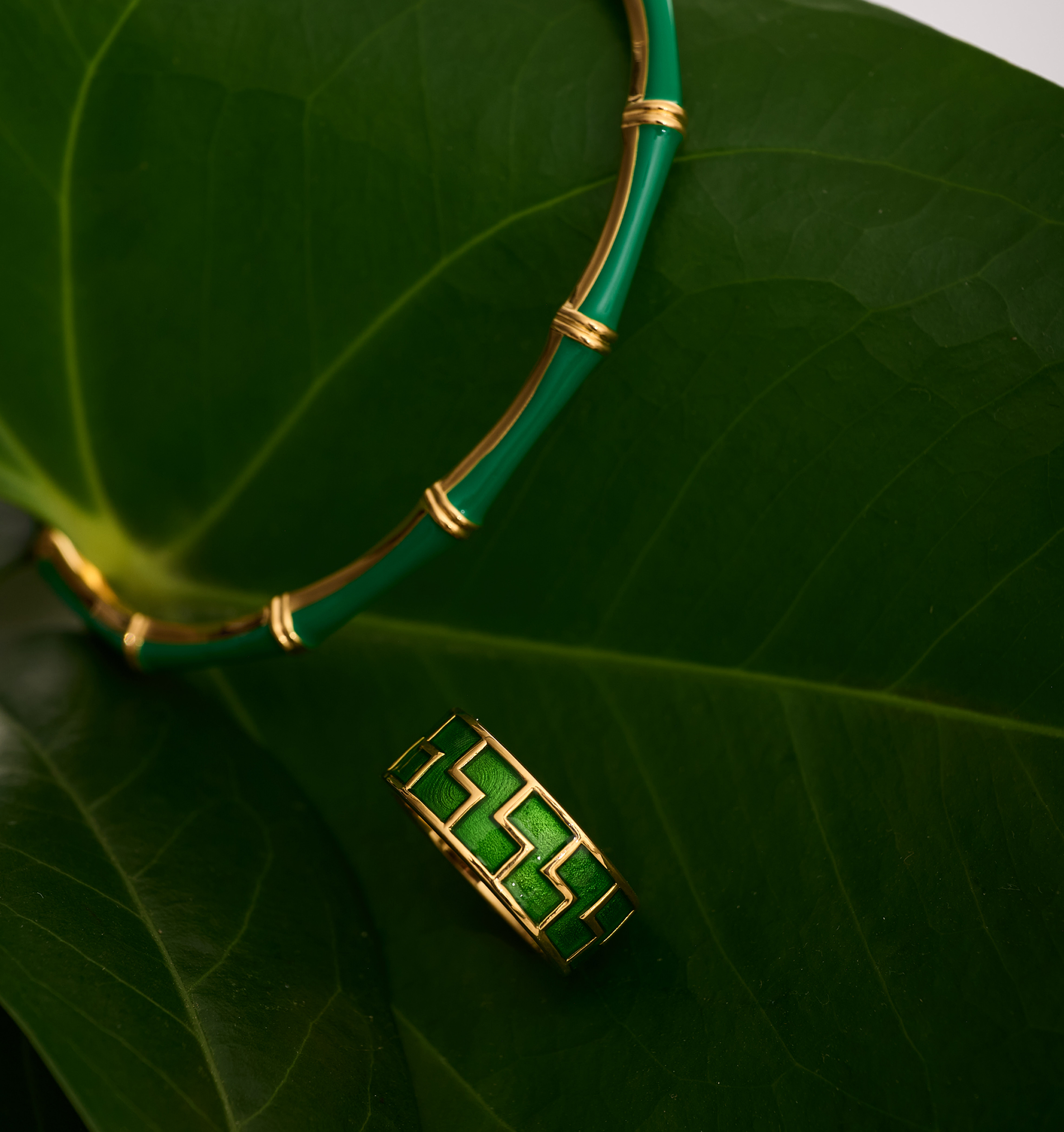 Arohi Ring gold and green geometric design on large green leaves