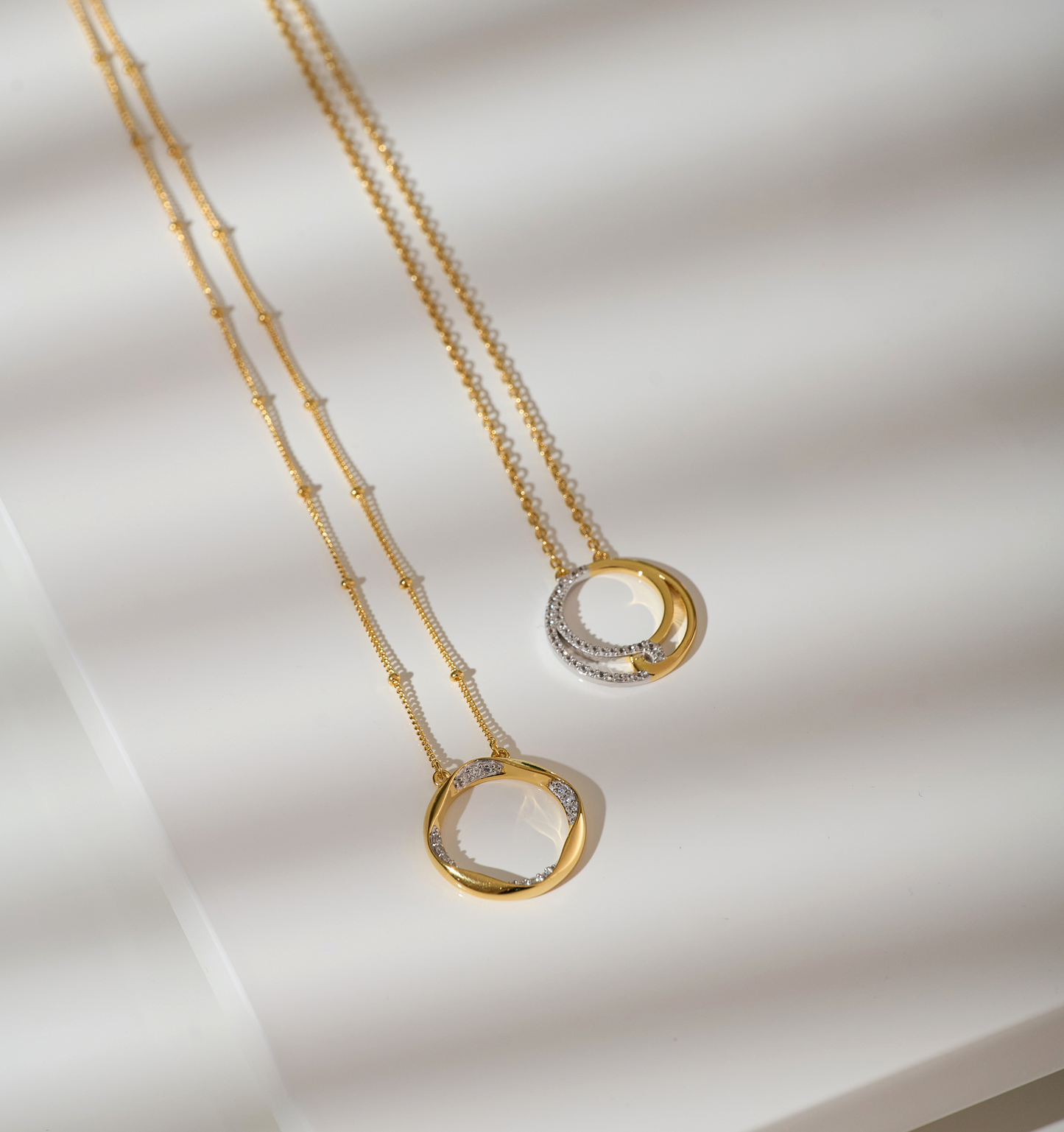 Taral Necklace featuring delicate gold and white topaz pendant with elegant circular design on fine gold chain