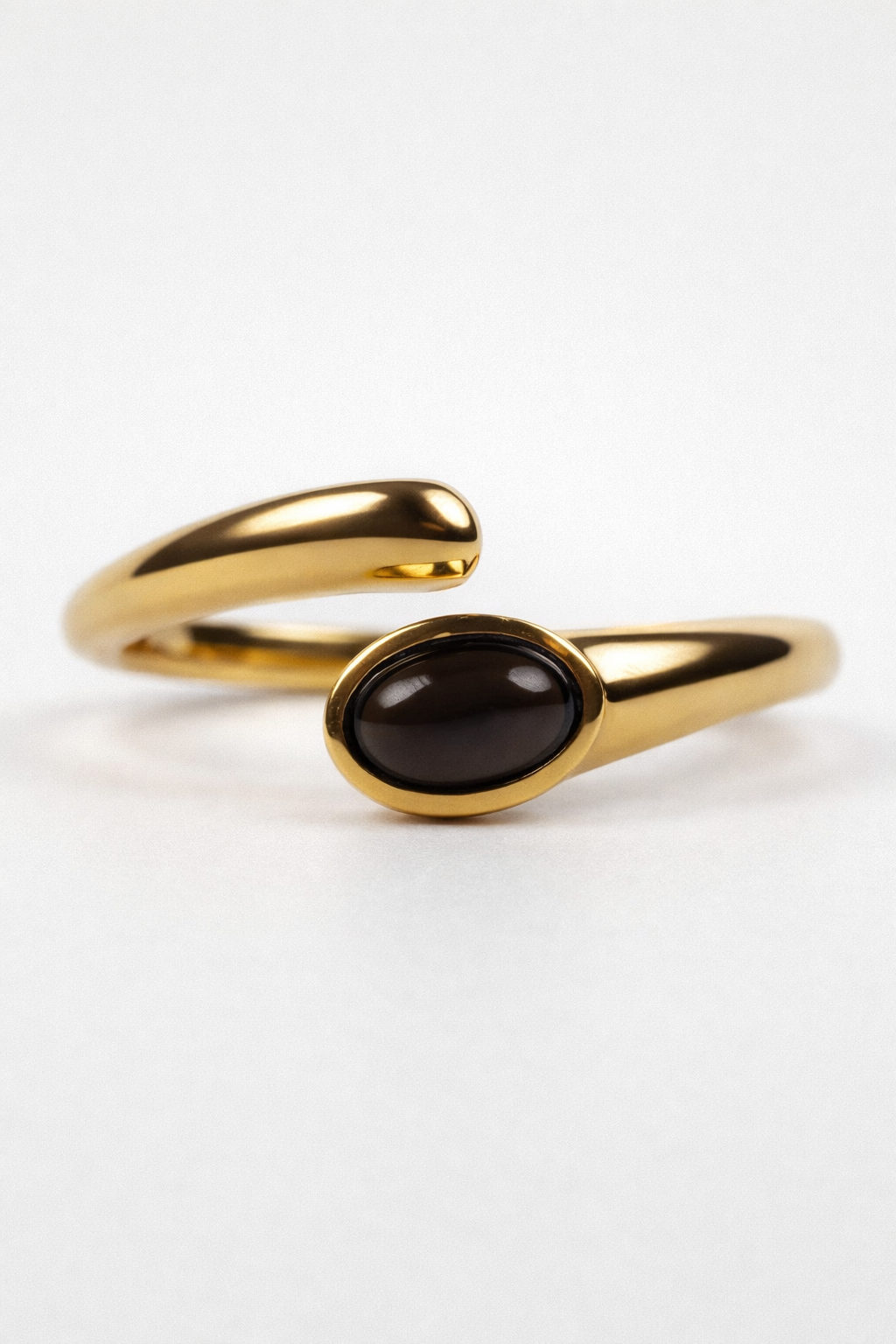 Raksh Ring with polished oval black obsidian and fluid open design for daily wear